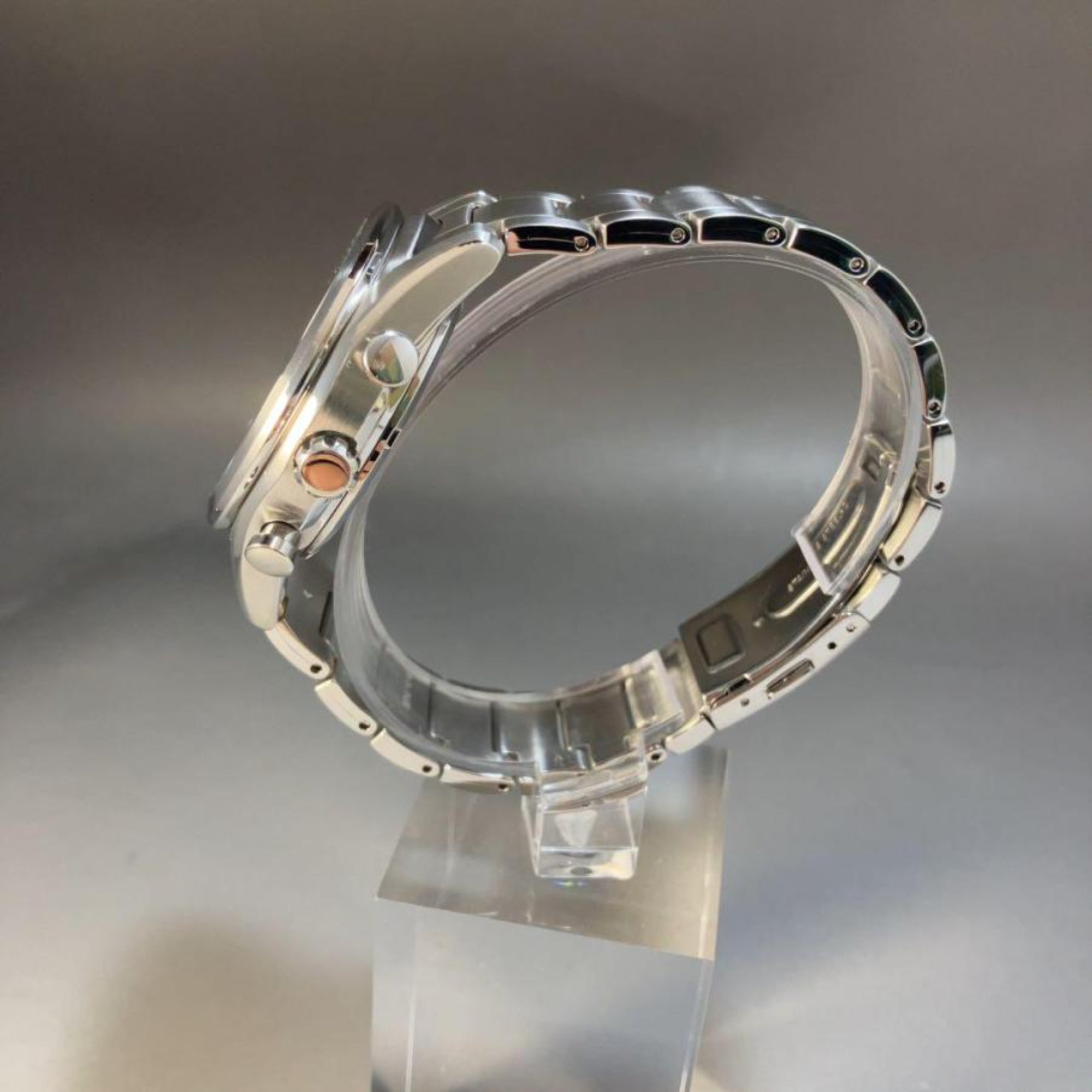 Seiko Essentials 41.4mm Solar Chronograph watch SSC801P1 side profile, displayed on a clear acrylic block
