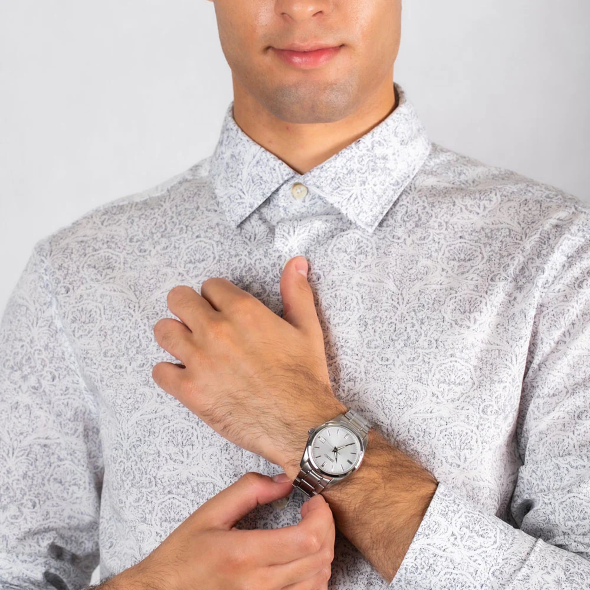 Seiko SUR307P1 silver dial watch worn on wrist by a man