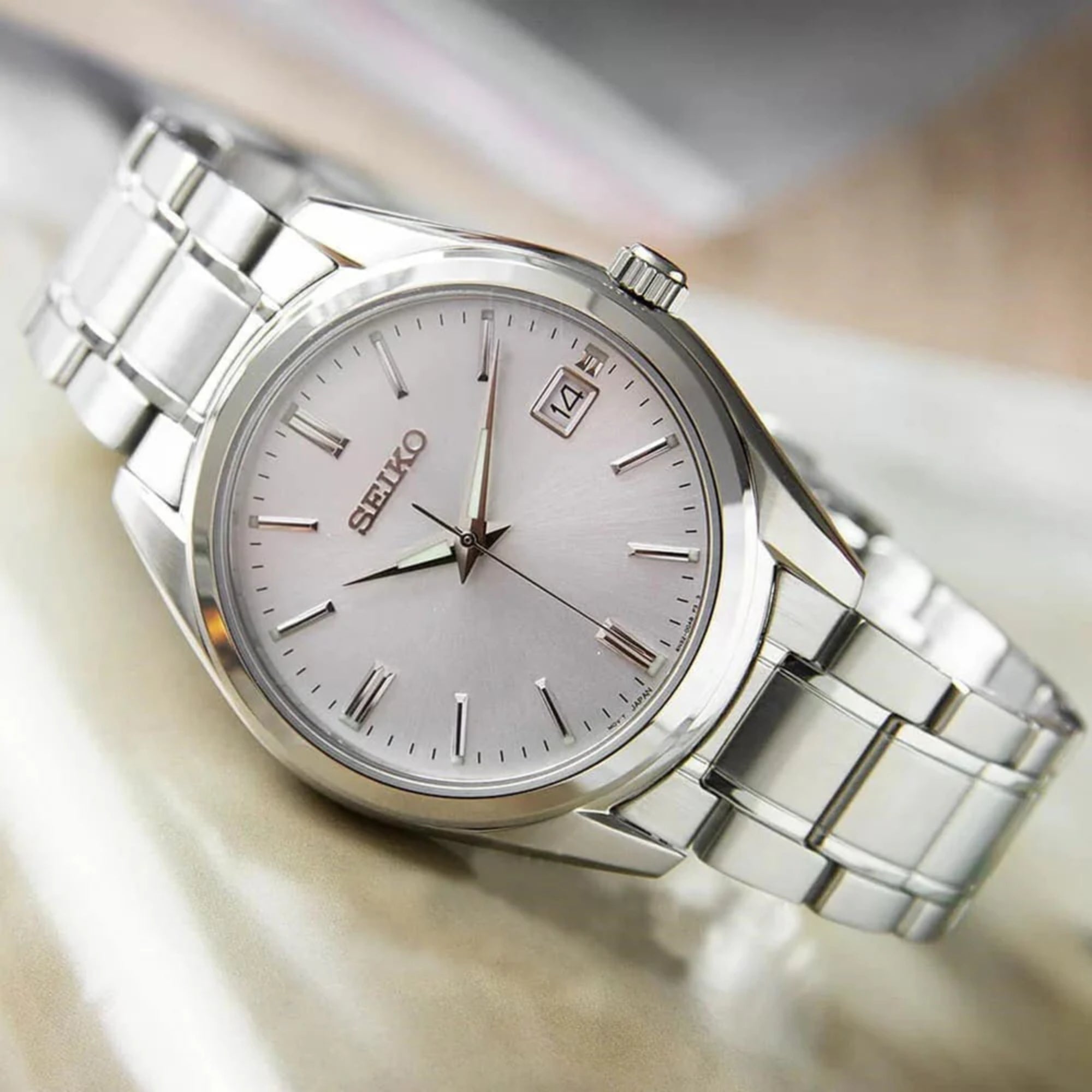 Seiko Essentials SUR307P1 silver dial quartz watch displayed at an angle