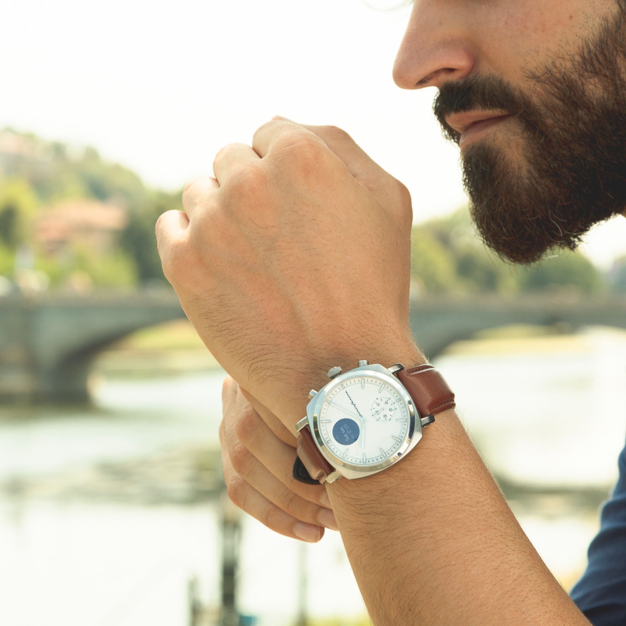 Pininfarina Senso Hybrid PMH01A-01 white dial watch showing digital screen complication close-up on wrist