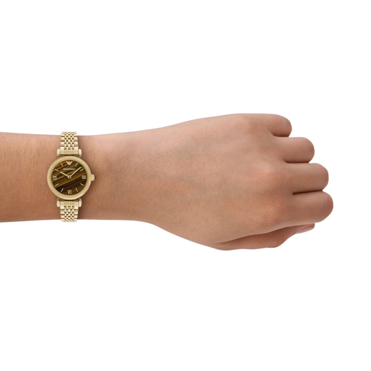 Gold-tone steel ladies quartz watch on wrist with brown dial and link bracelet