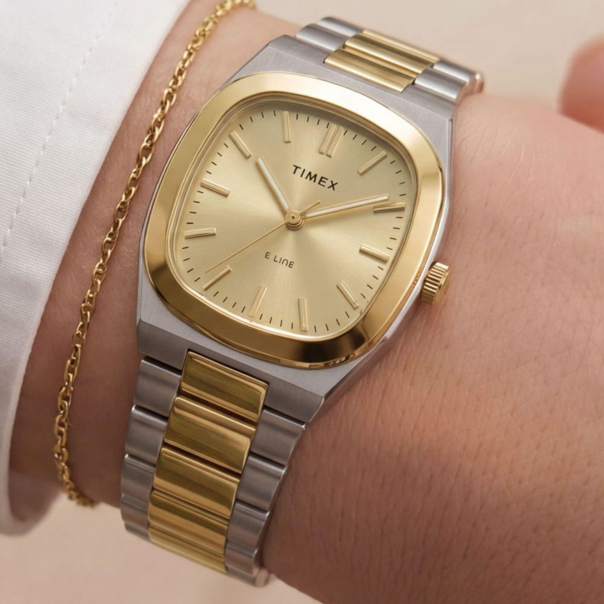 Timex E Line TW6A00800 wrist view showing champagne dial ladies watch styled on a person wearing a two-tone steel bracelet