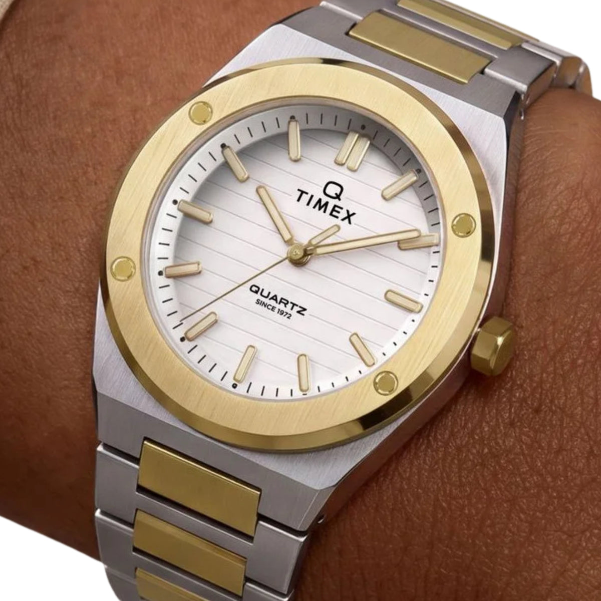 Timex Q Marbella TW2Y81900 wrist view showing silver dial quartz watch styled on a person wearing a two-tone steel bracelet