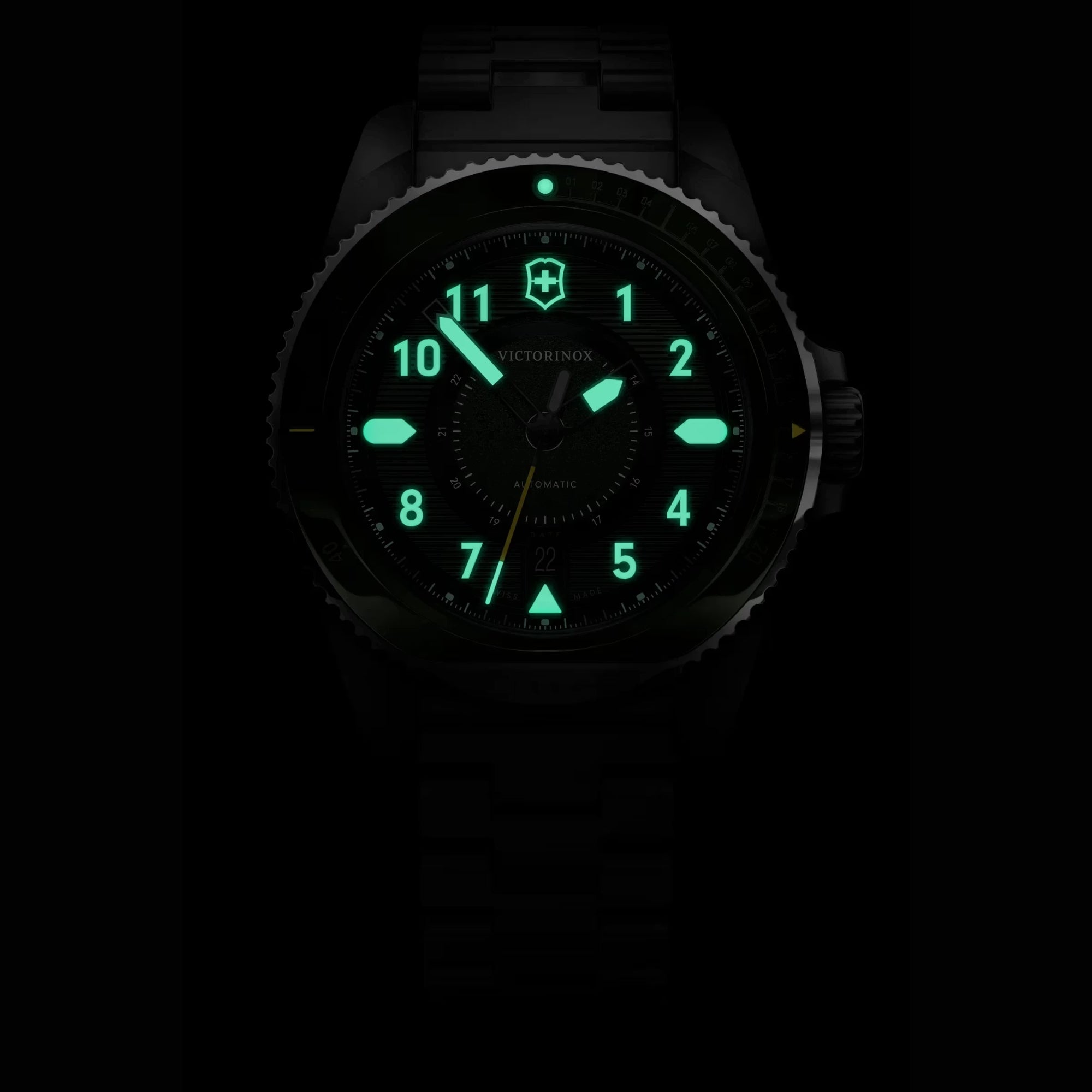 Victorinox Journey 1884 242015 green dial automatic watch in darkness showing glowing green lume hands and markers