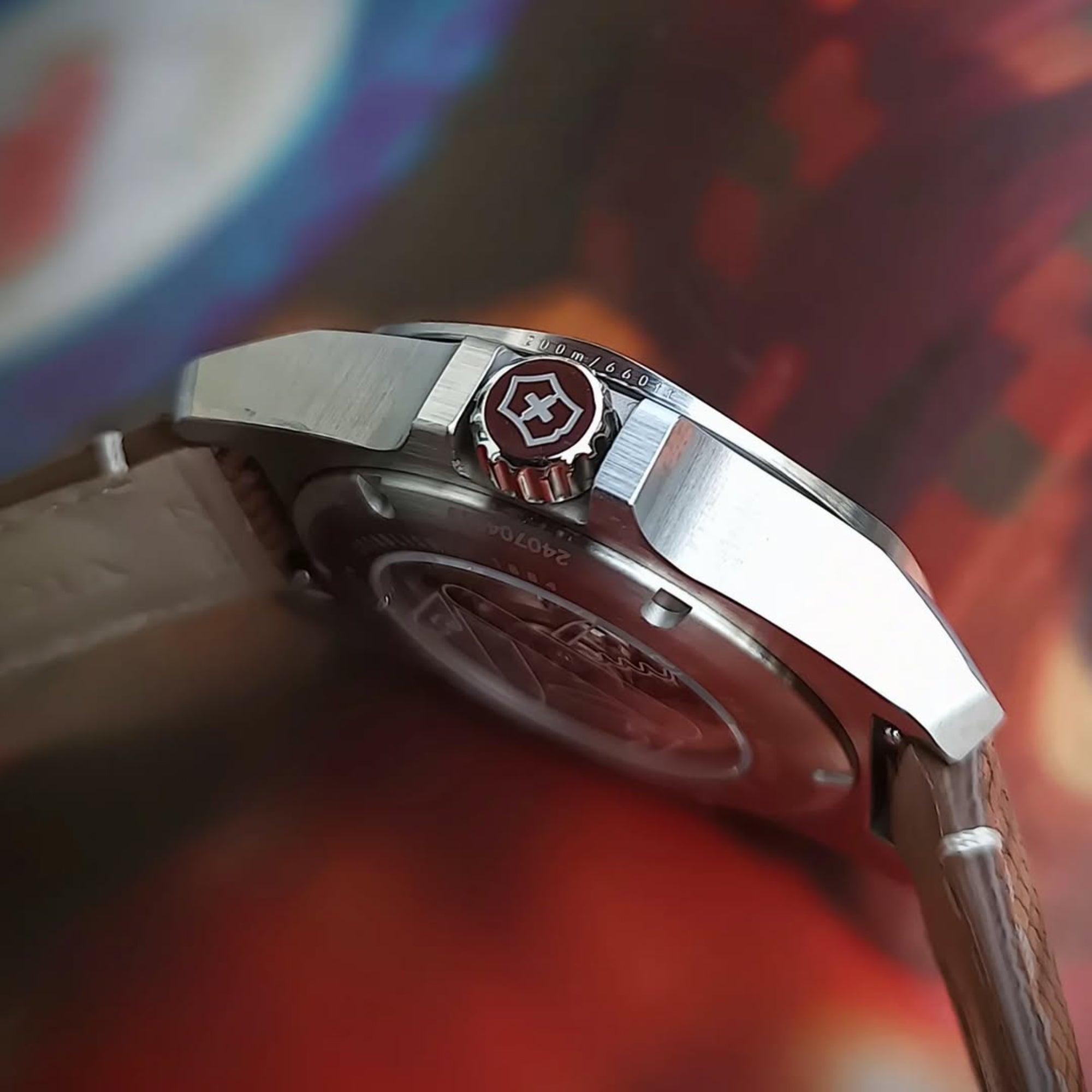 A side-profile view of a stainless steel Victorinox watch