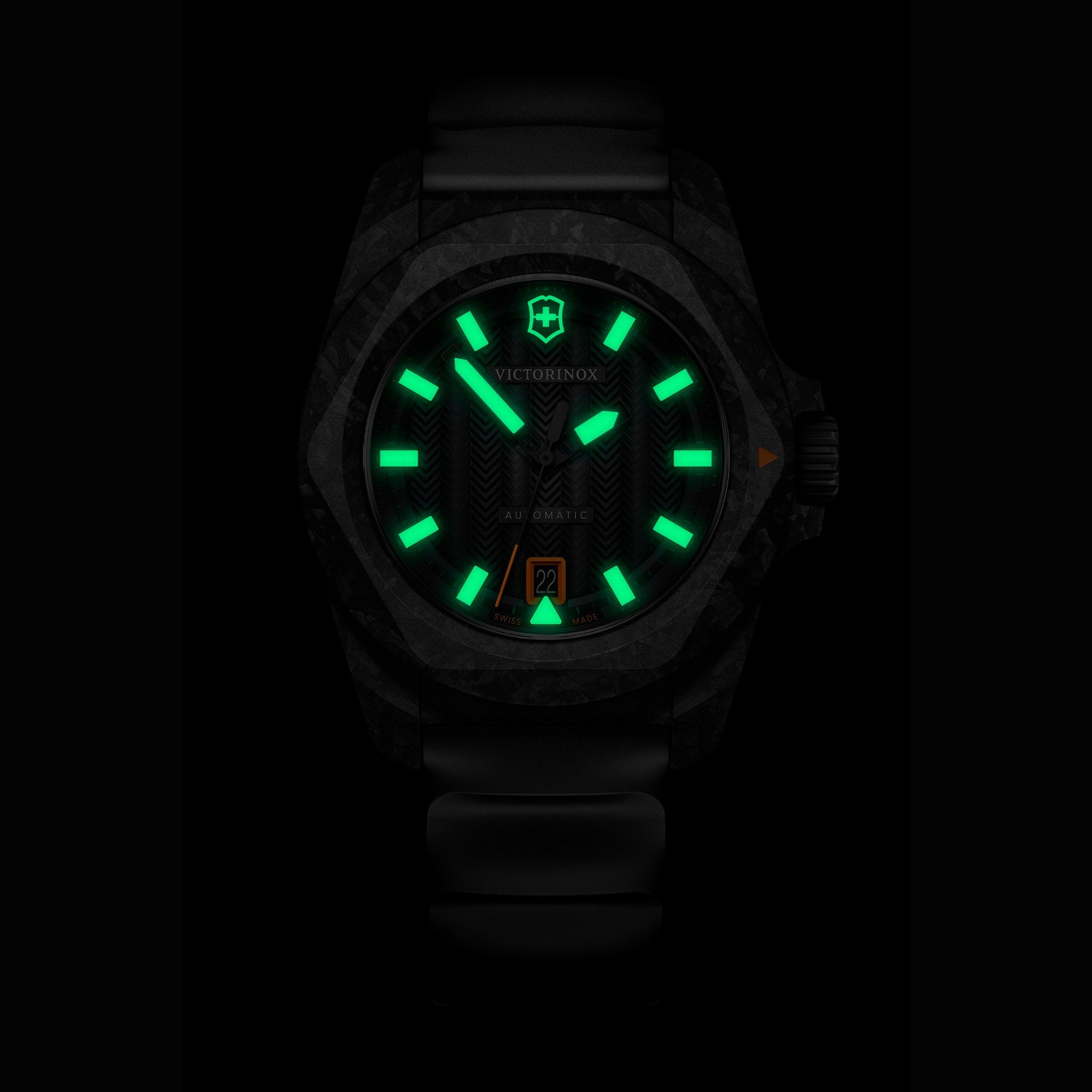 Victorinox I.N.O.X. black dial automatic watch 242023.1 in dark environment