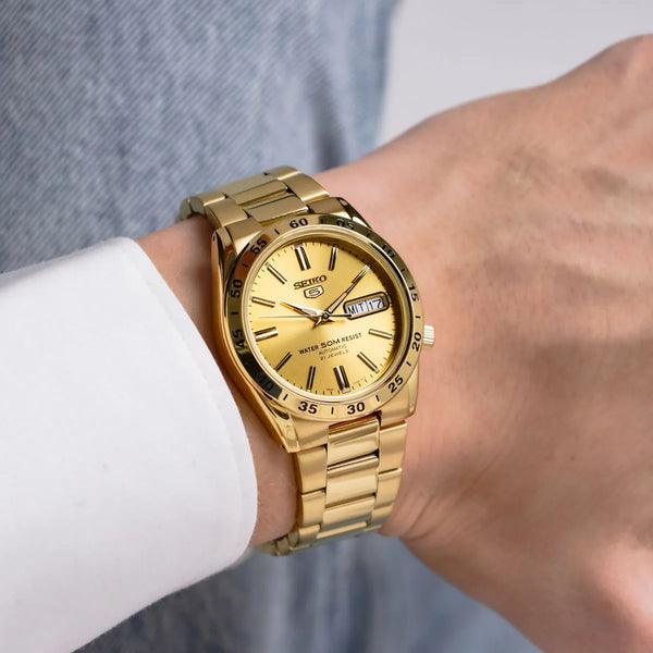Seiko 5 automatic gold sunburst dial gold PVD watch on wrist