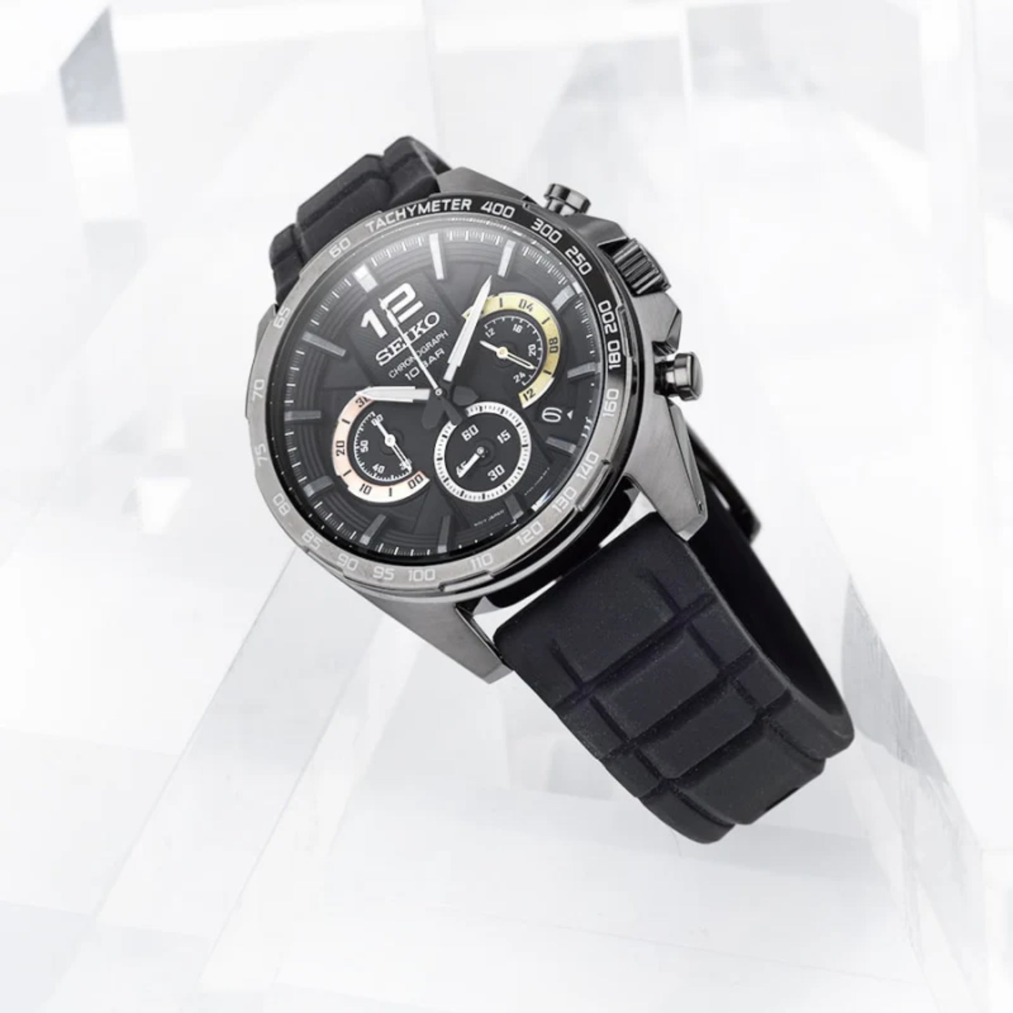 Black Seiko watch with a detailed face on a white background