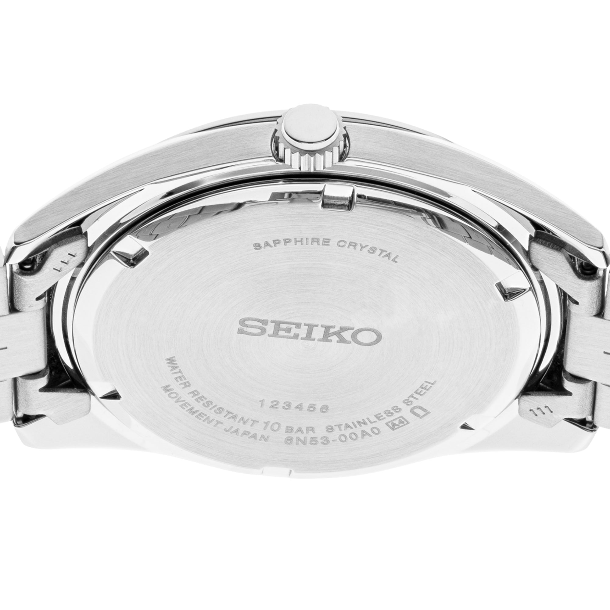 Seiko Essentials SUR373P1 titanium quartz watch caseback showing engravings on white background