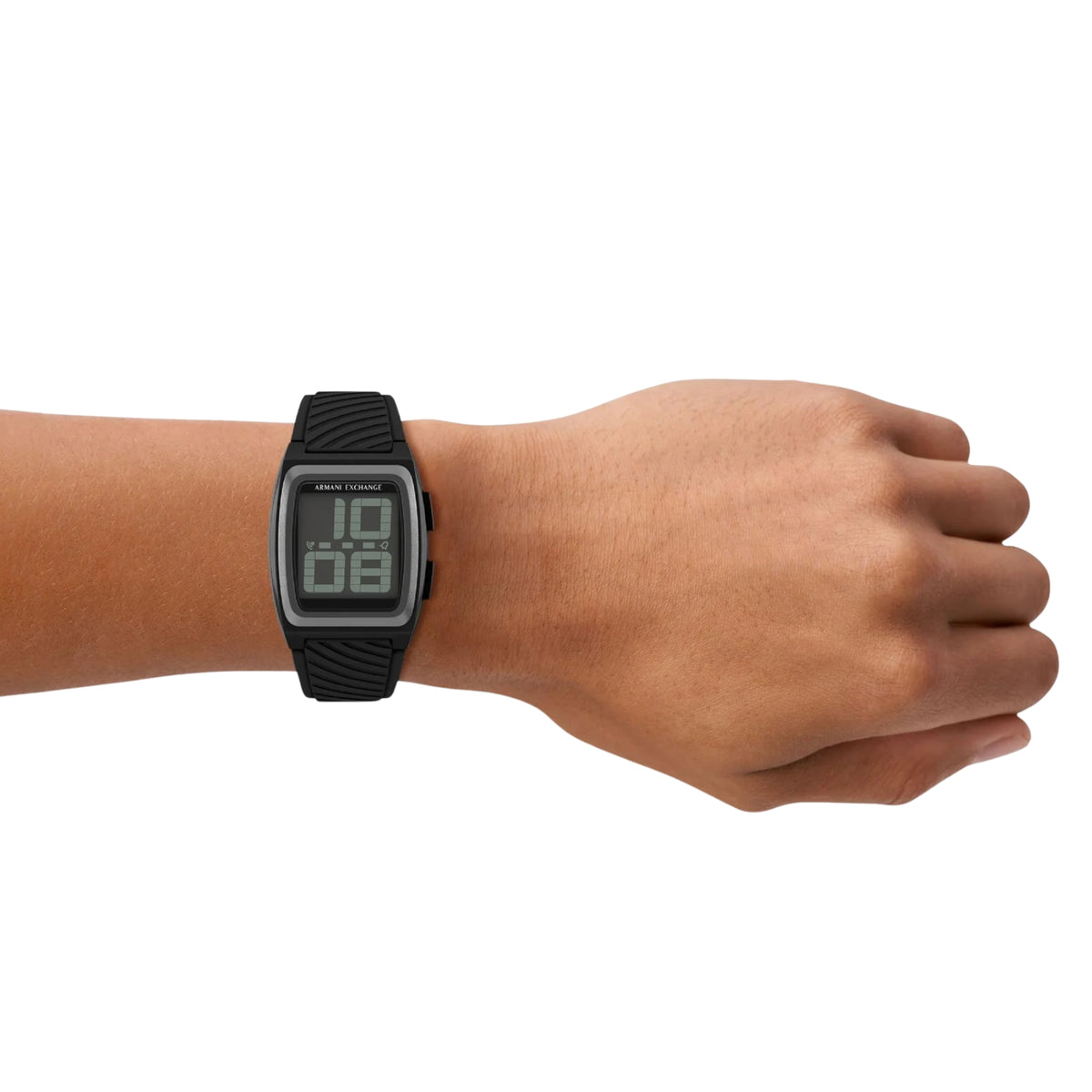 Black digital silicone watch on wrist with LCD time readout and ridged strap