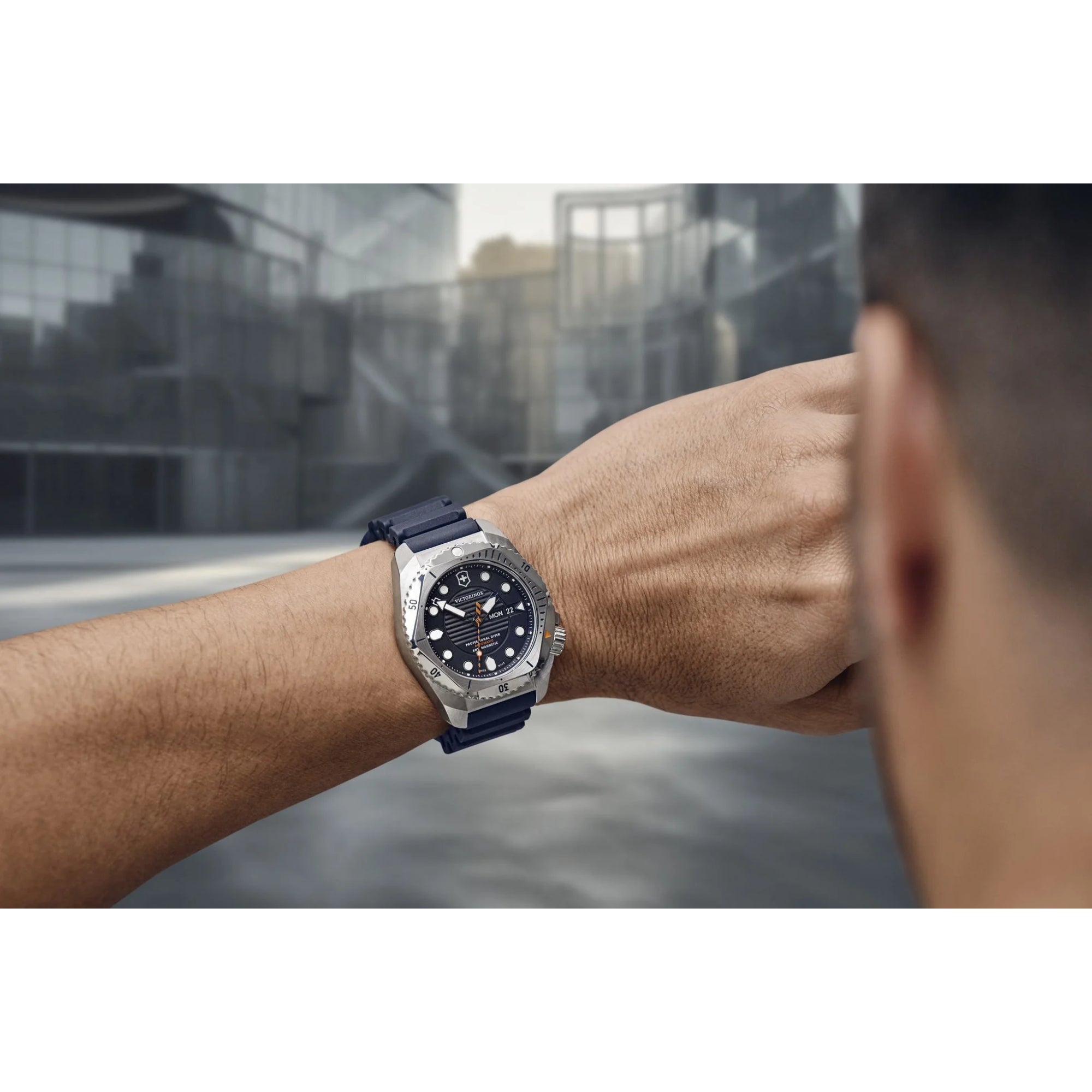 Victorinox Dive Pro automatic watch worn on wrist in lifestyle setting showing the blue dial and rugged design
