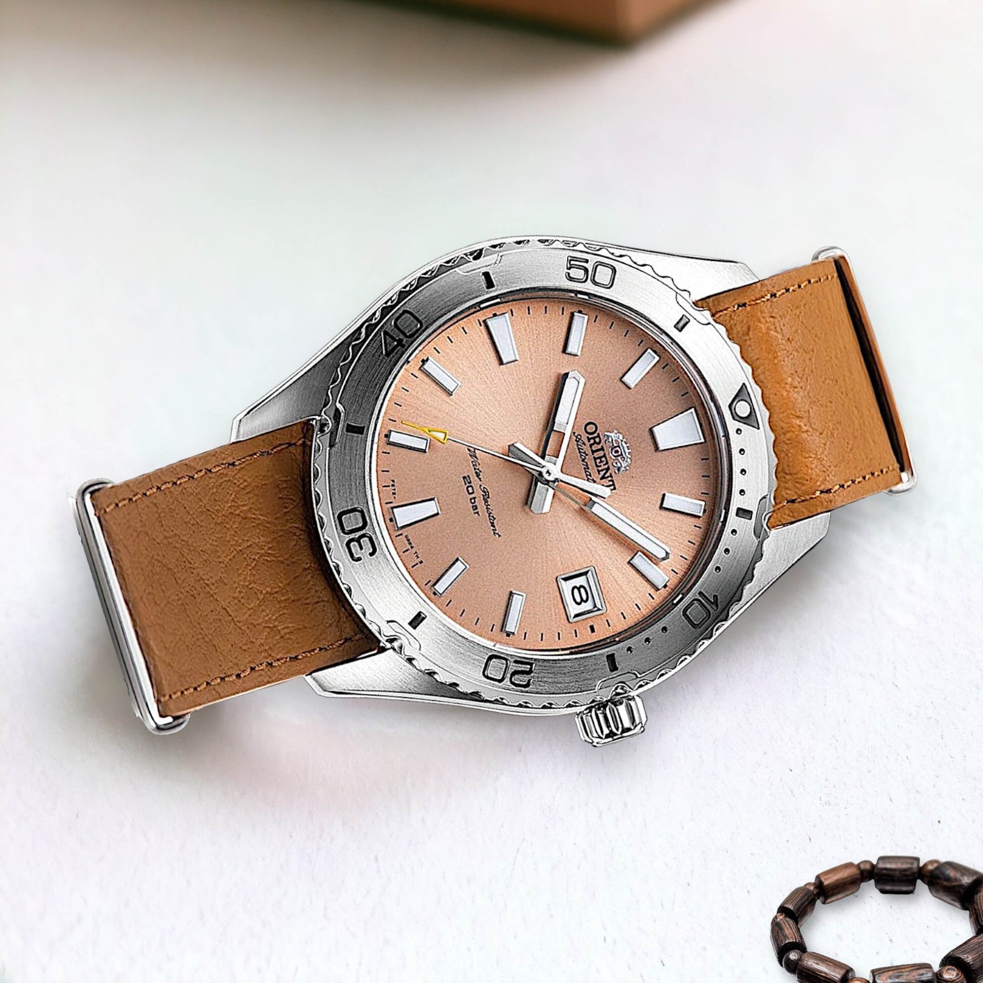 Orient Mako RA-AC0Q05P30B automatic dive watch resting on a white surface