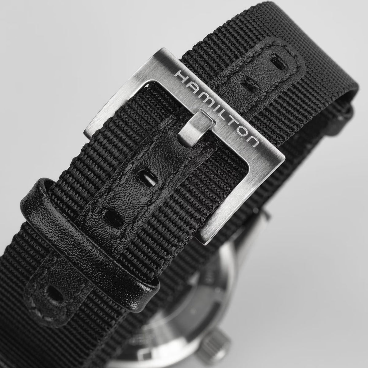 Hamilton Khaki Field H69439910 black NATO textile strap and pin buckle detail