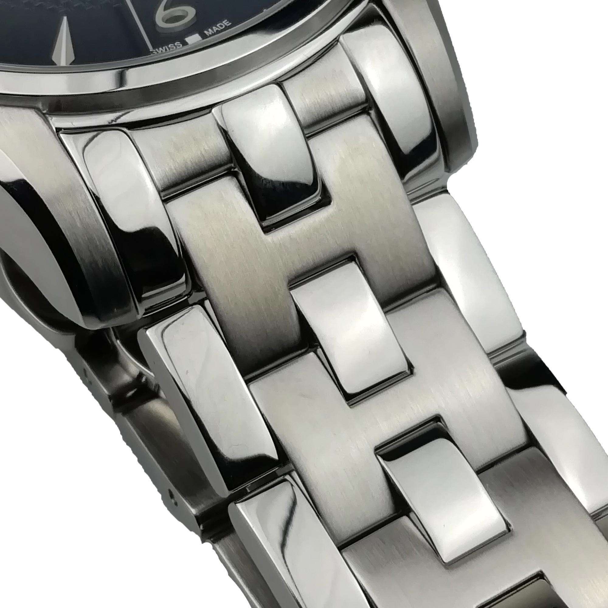 Close-up of a silver watch band with a detailed design on a white background