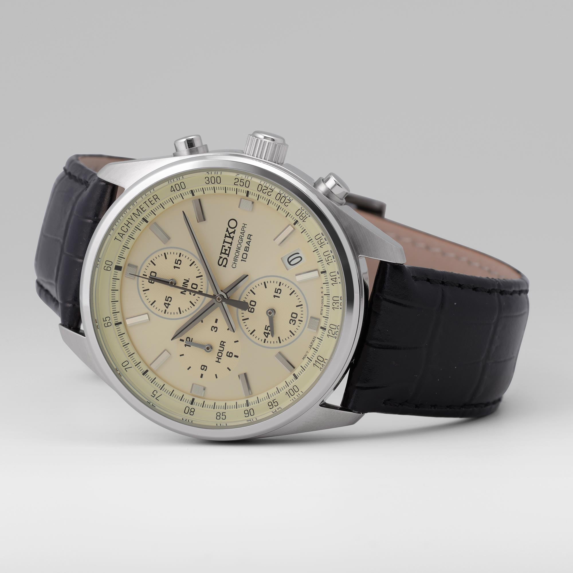 Angled view of Seiko Essentials SSB383P1 chronograph watch with cream dial and black leather strap