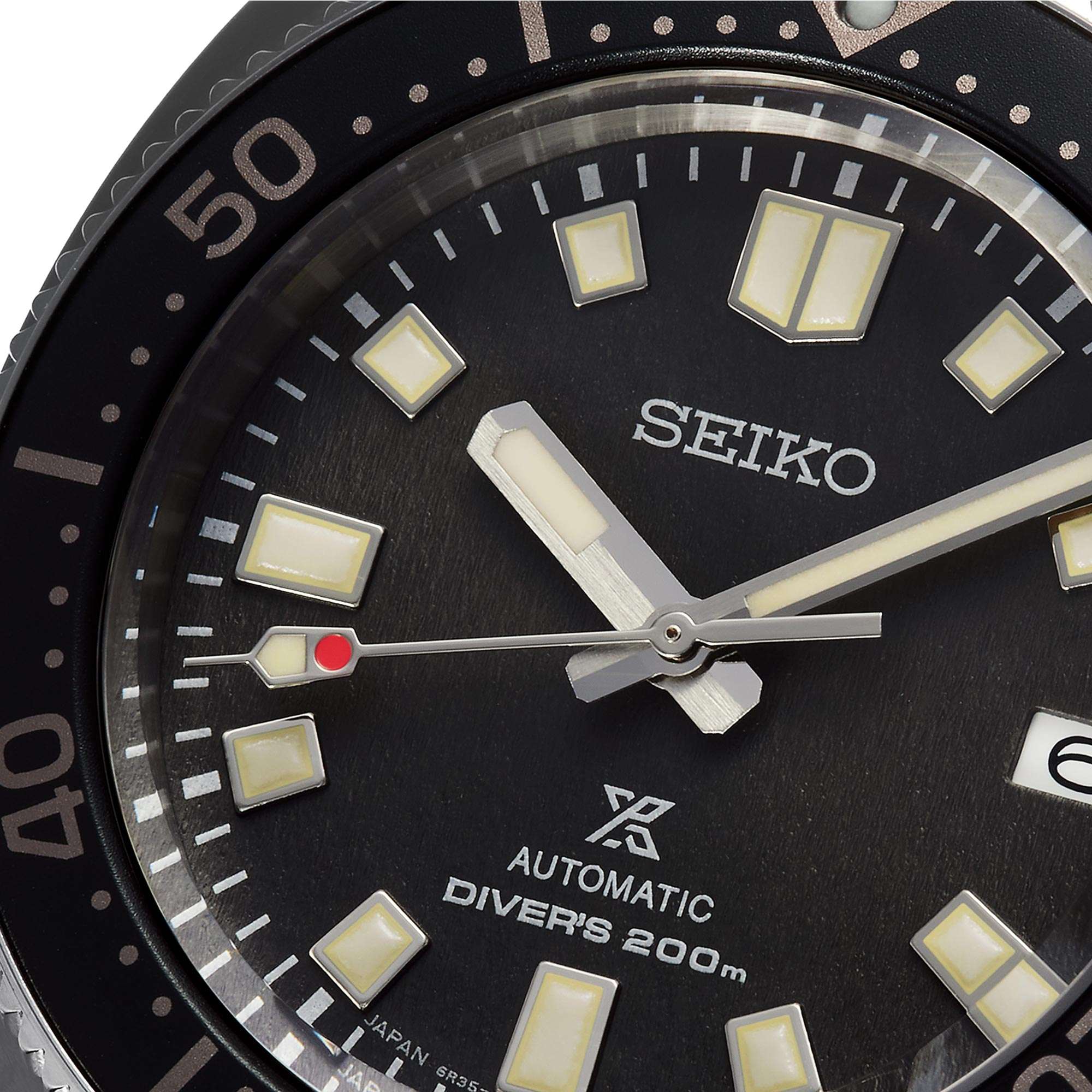 Seiko watch face with black dial and white markings