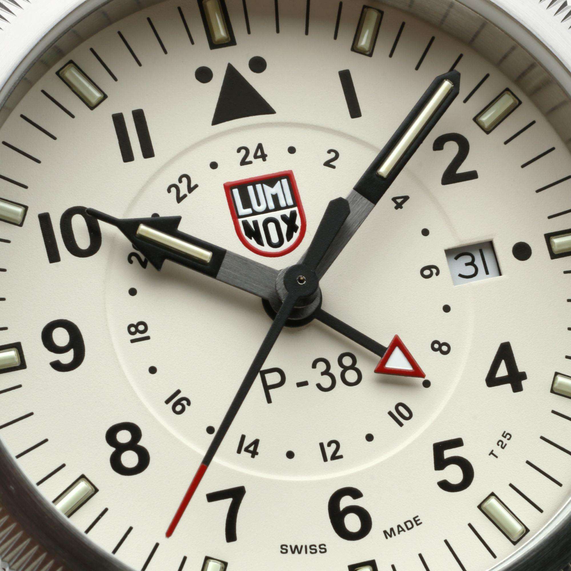Luminox P-38 XA.9527 Swiss-made watch dial, showcasing its cream face, bold Arabic numerals and date window.