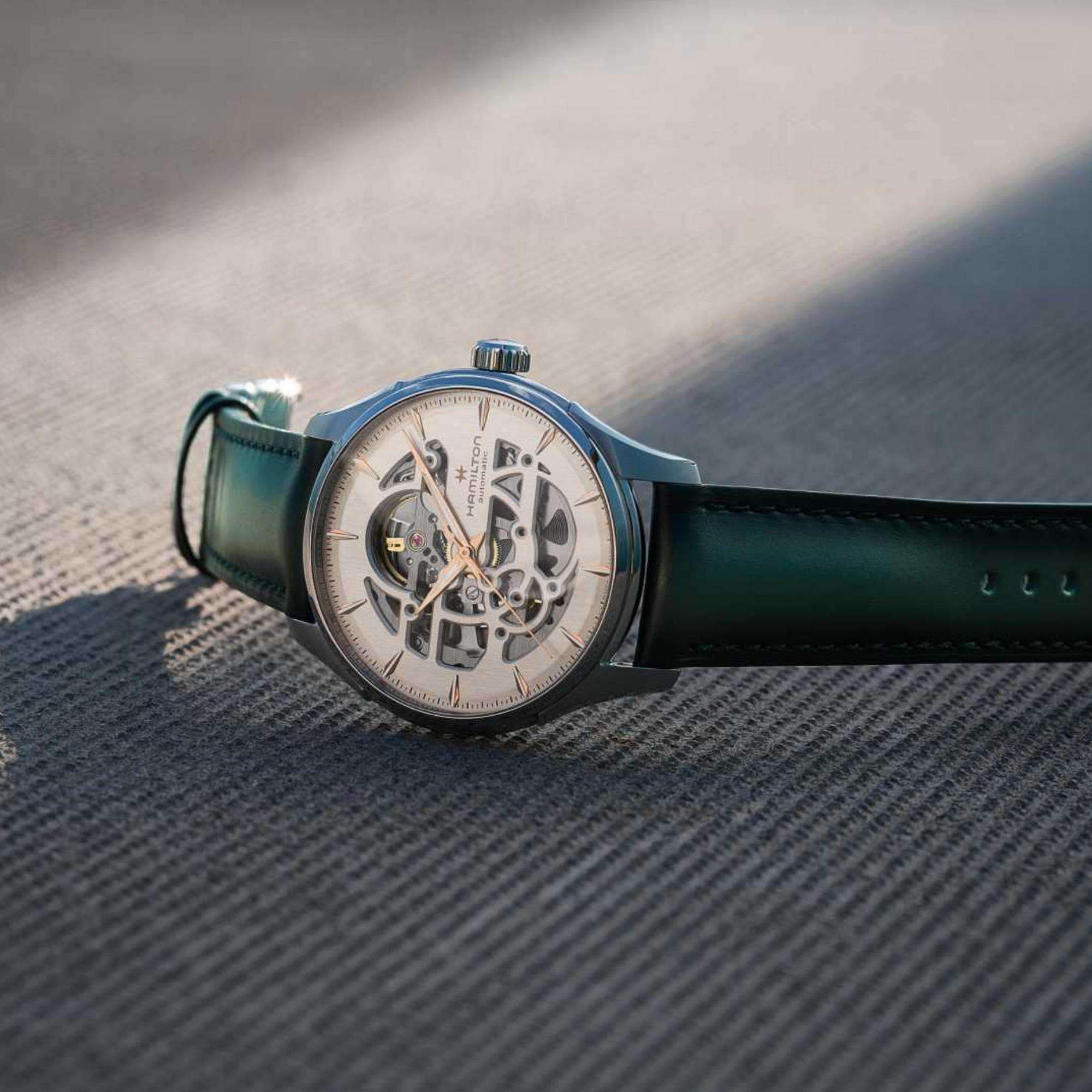 Hamilton Jazzmaster Skeleton watch with a white dial and dark green leather strap