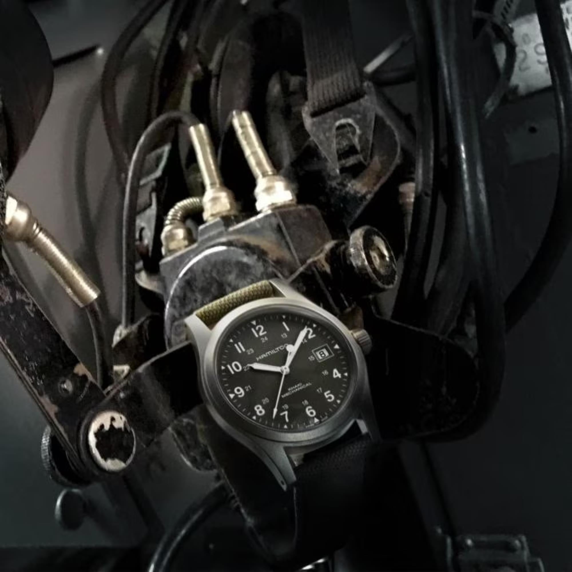 Hamilton Khaki Field Mechanical H69439363 watch with a green dial and green canvas strap.