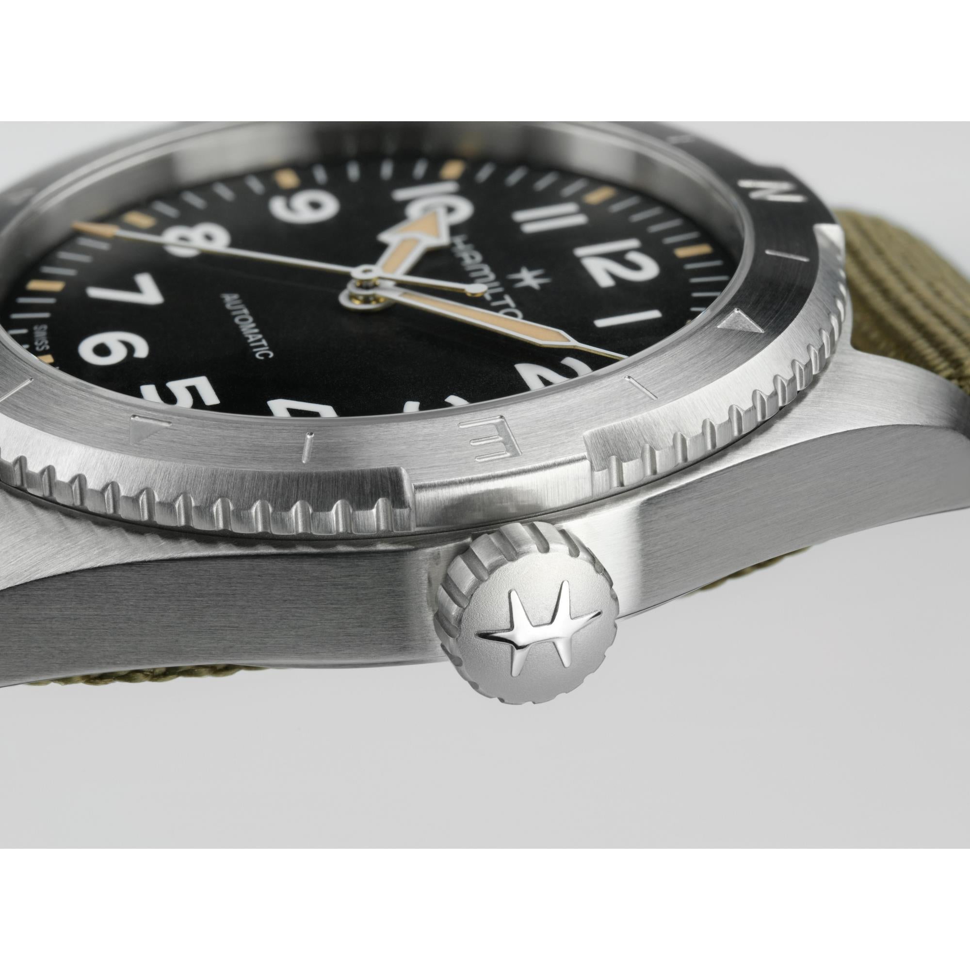 Brushed steel Hamilton watch crown and bezel close-up
