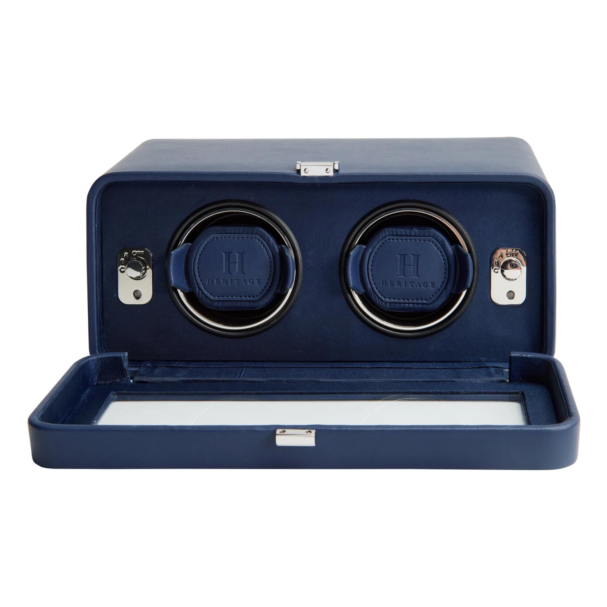 Blue watch winder with two rotating compartments on a white background