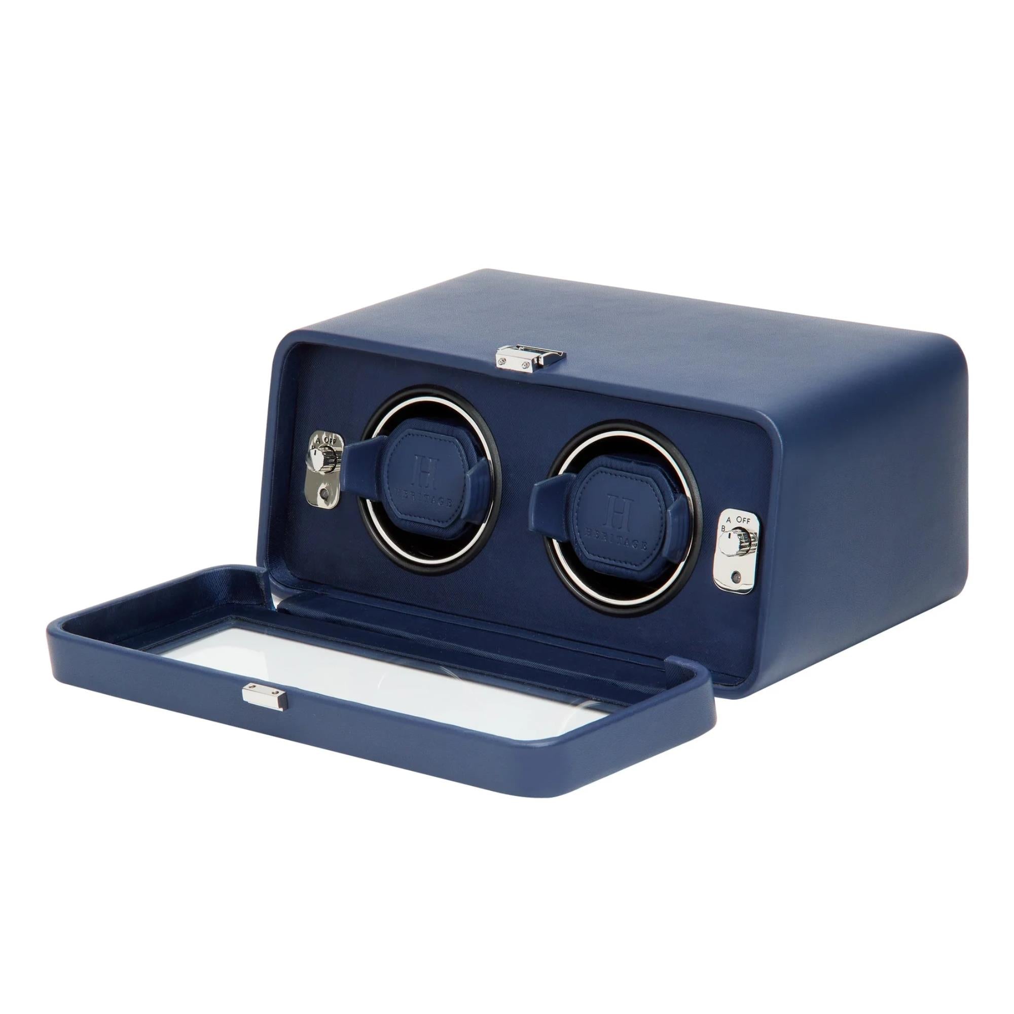 Blue watch winder with two rotating compartments on a white background