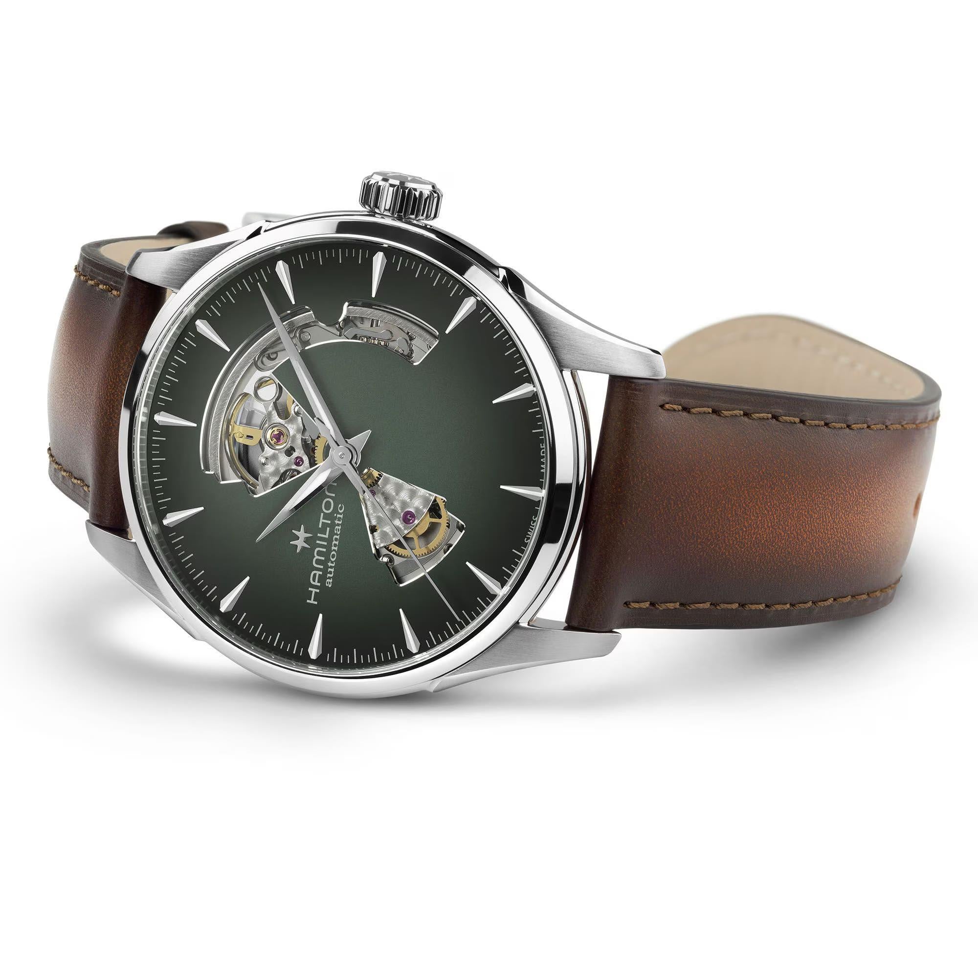 Hamilton Jazzmaster Open Heart watch with a green skeleton dial and brown leather strap.