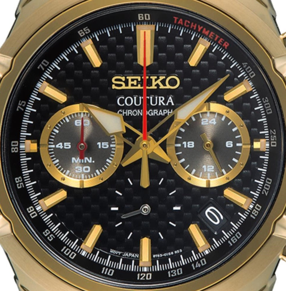 Seiko Coutura watch with gold case and black dial on a white background