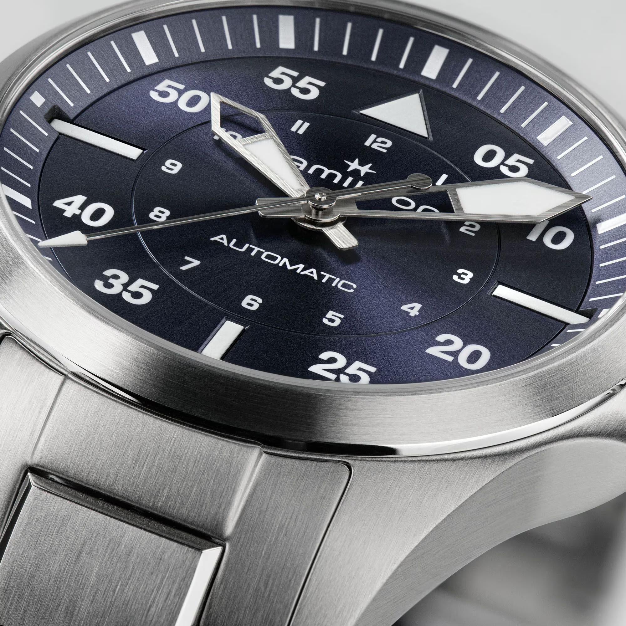 Hamilton H76215140 blue dial with large Arabic numerals and luminous hands close-up