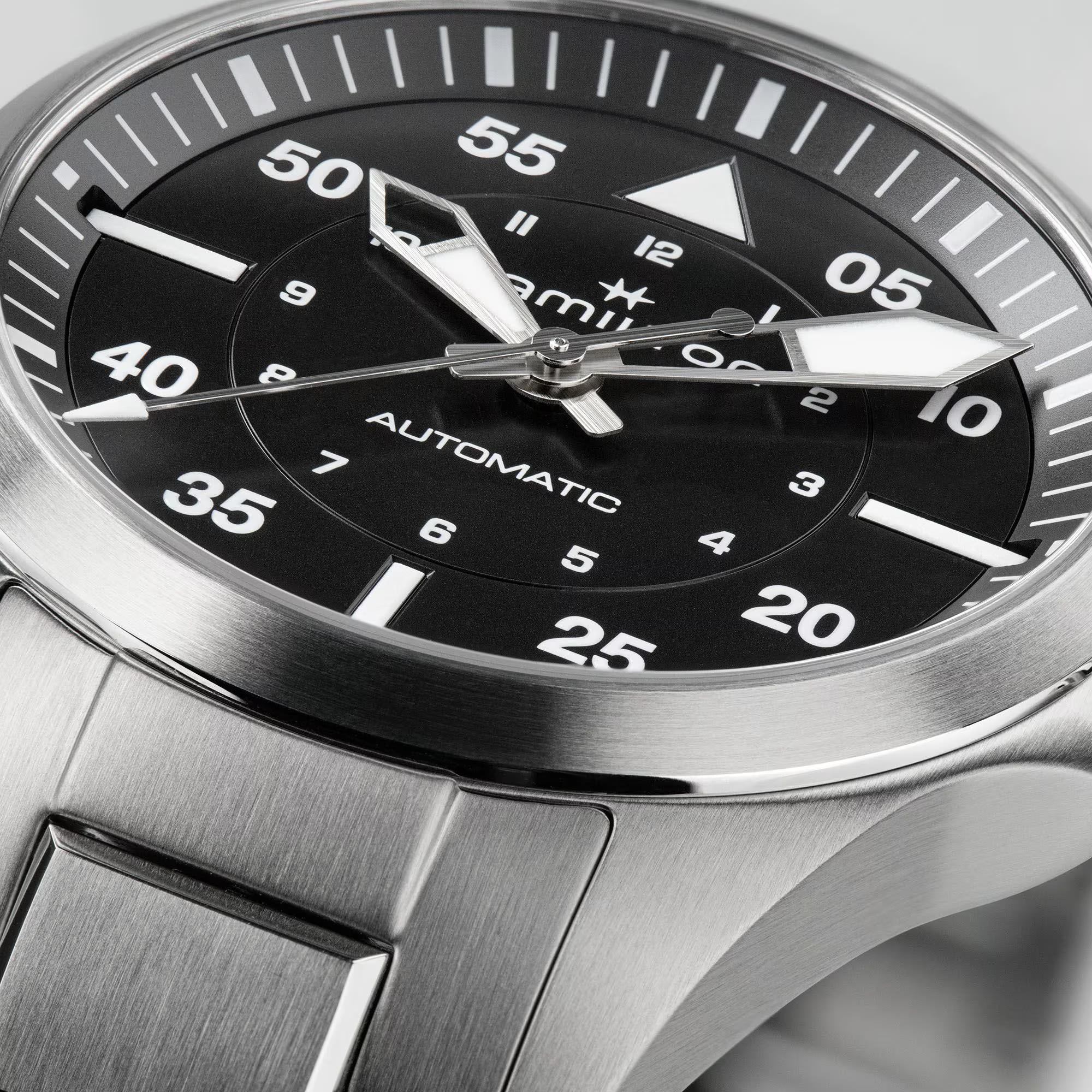 Hamilton Khaki Aviation H76215130 black satin dial with white Arabic numerals close-up