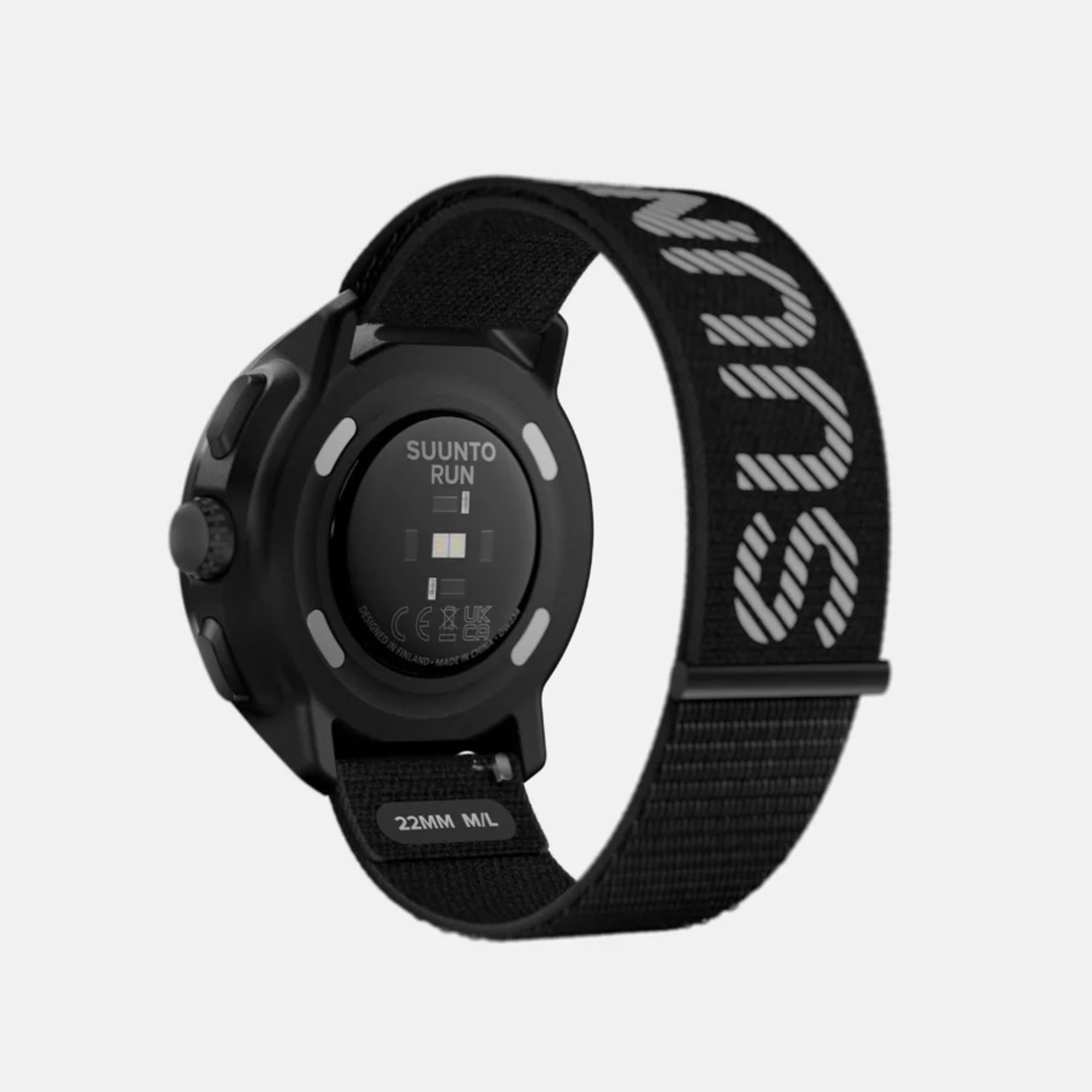 Black Suunto smartwatch with a branded strap on a light gray background