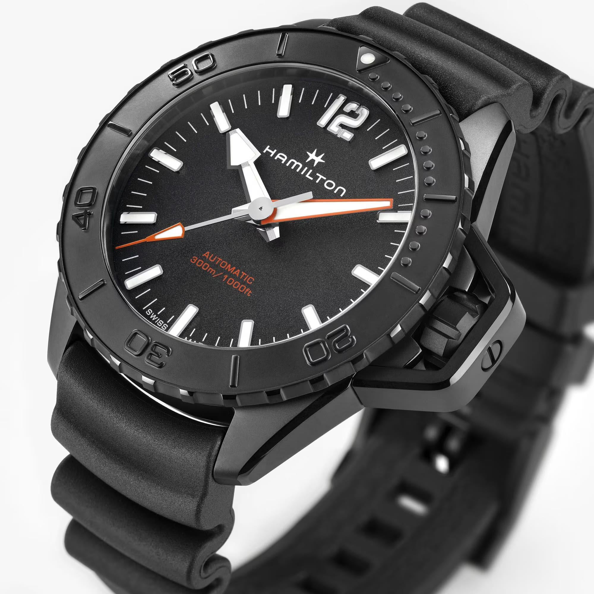 Angled view of the Hamilton Khaki Navy watch H77855330 showing its rugged black case, rotating bezel, crown, and black rubber strap details.