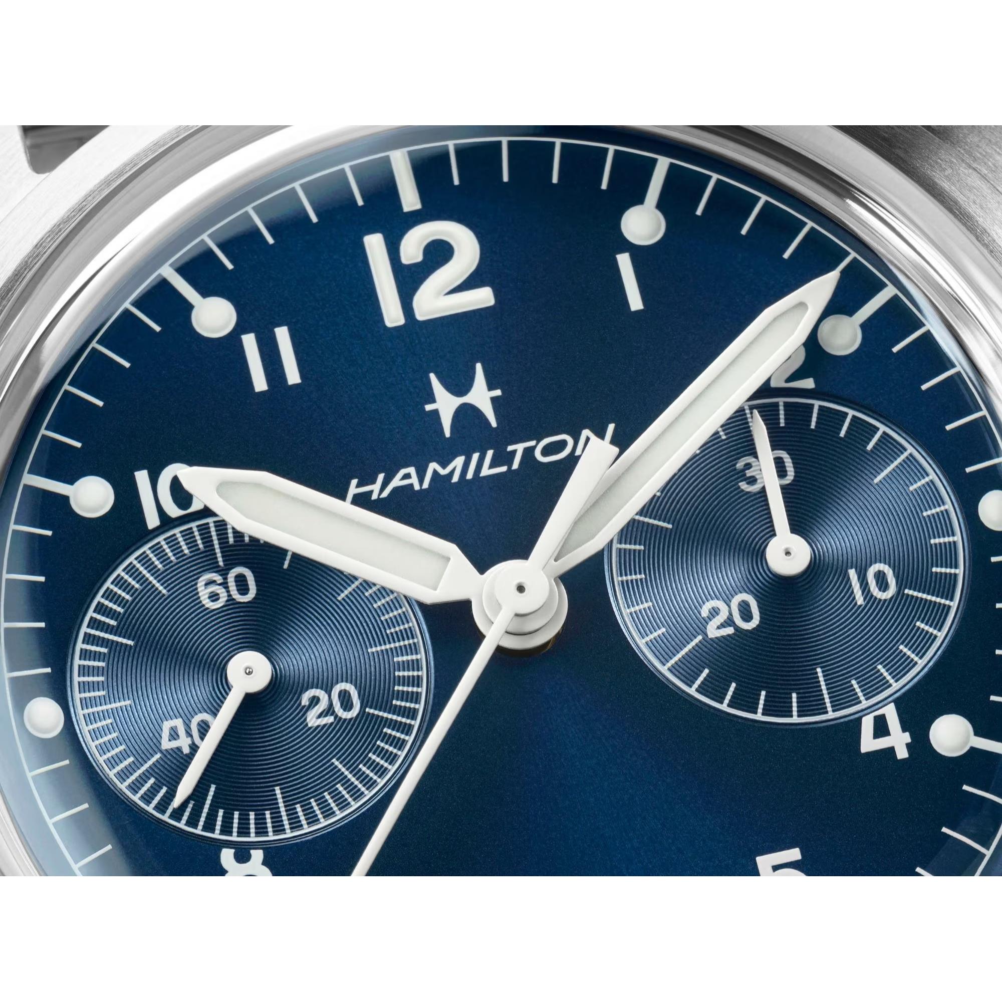 Close-up of a blue Hamilton Khaki Aviation watch dial with two textured sub-dials and white syringe-style hands