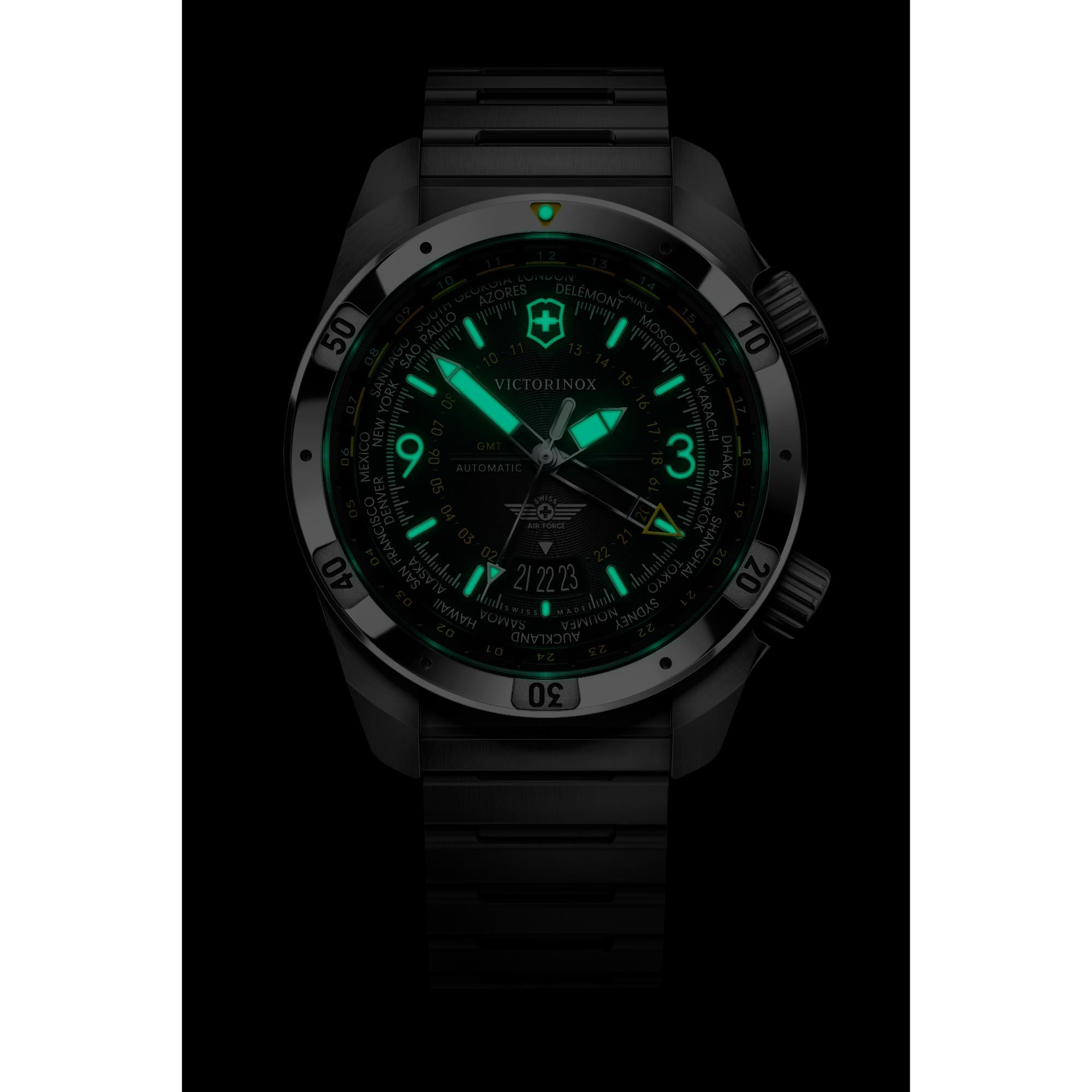 Victorinox Air Pro 242004 GMT automatic watch with green luminous hands in dark environment