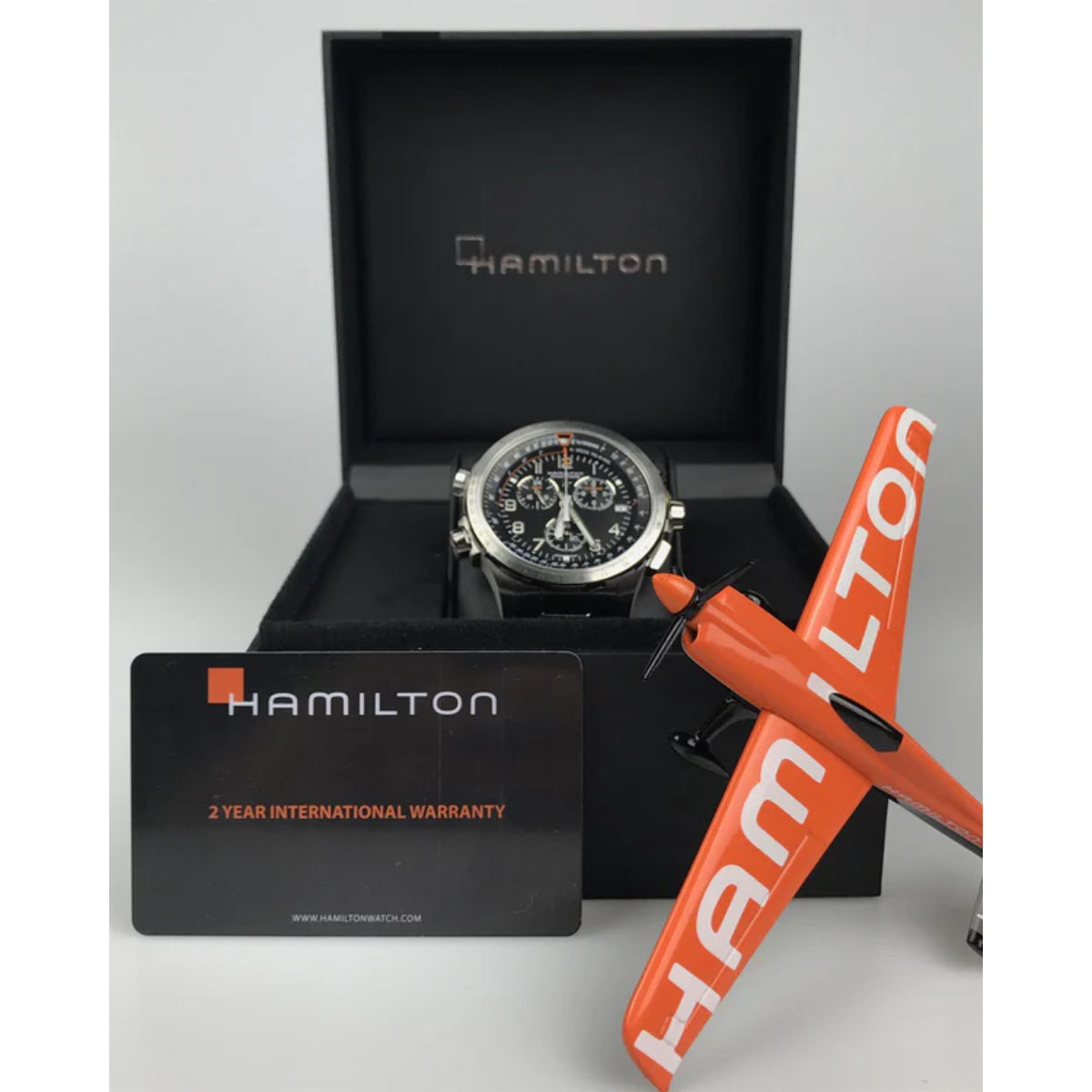 Hamilton chronograph watch presented in official black watch box with Hamilton warranty card and orange airplane model