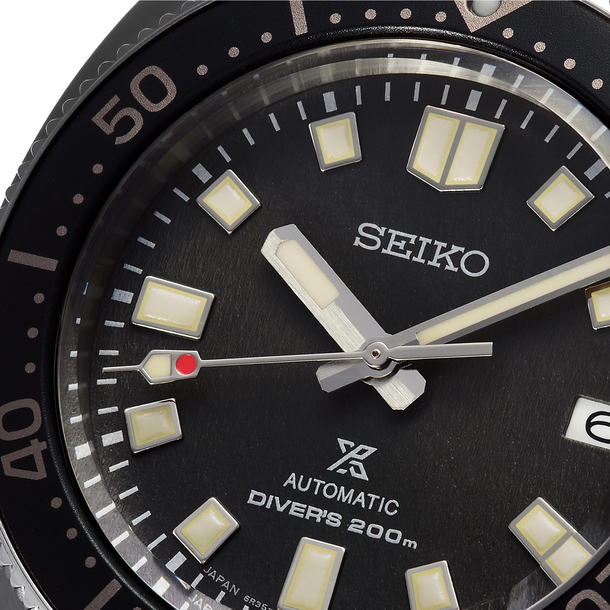 Seiko watch face with black dial and white markings