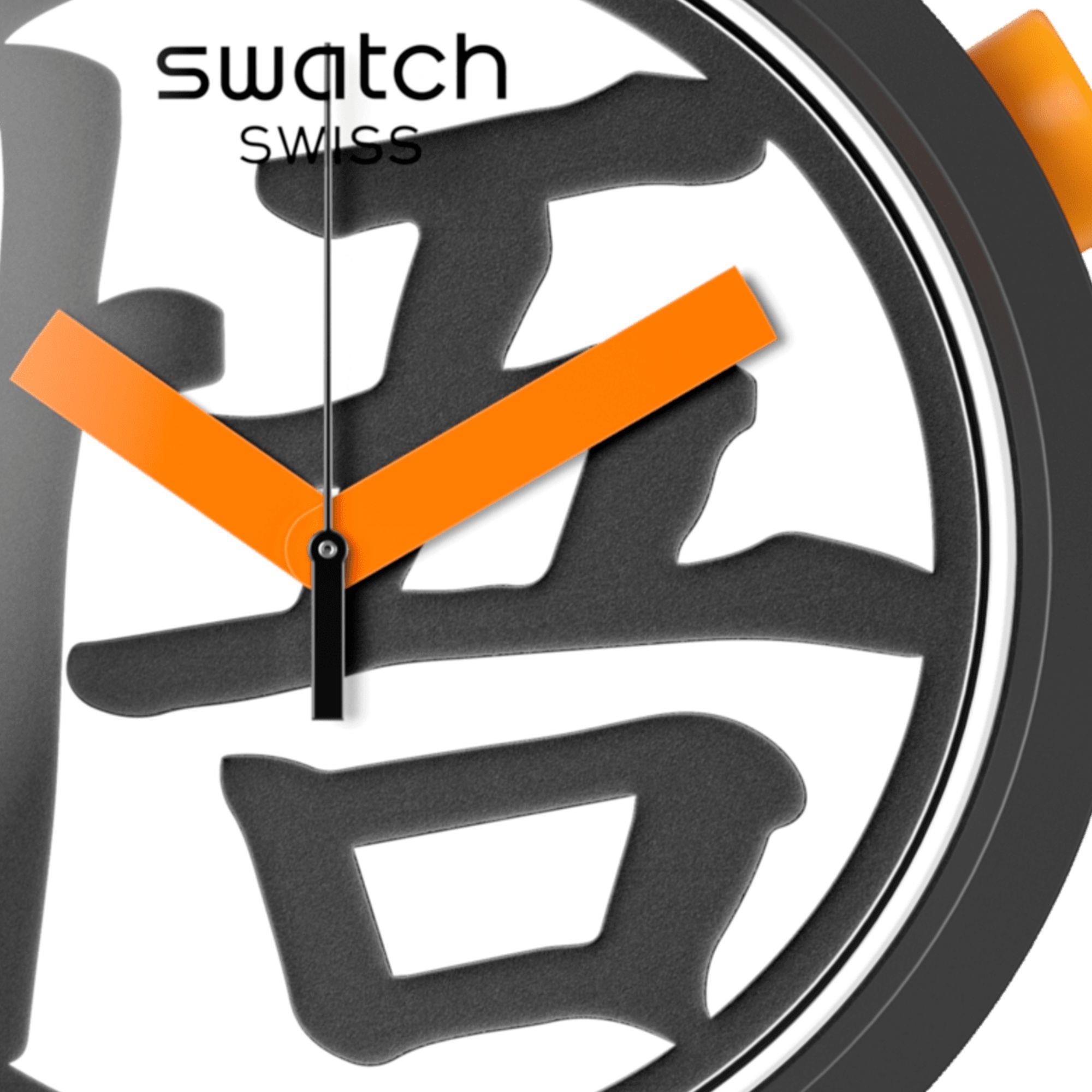 Swatch watch face with black and orange design on a white background