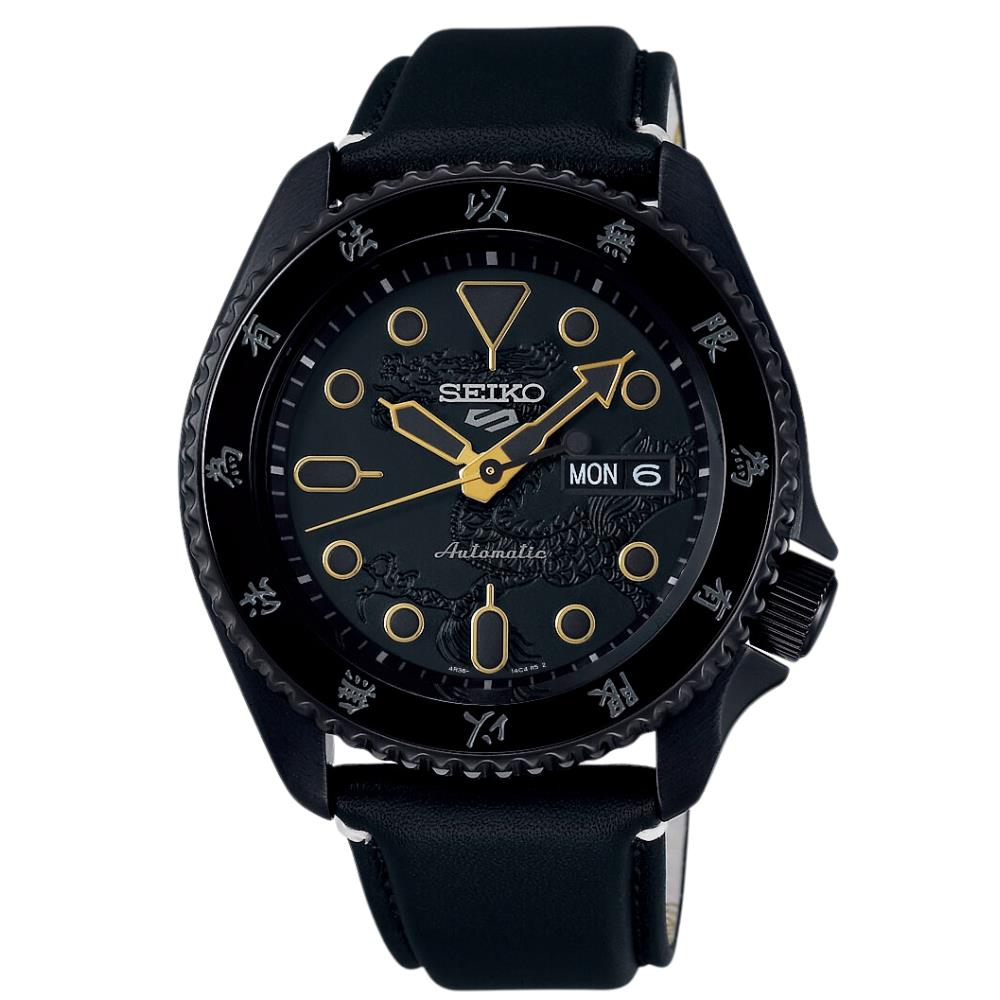Black Seiko watch with gold accents on a white background