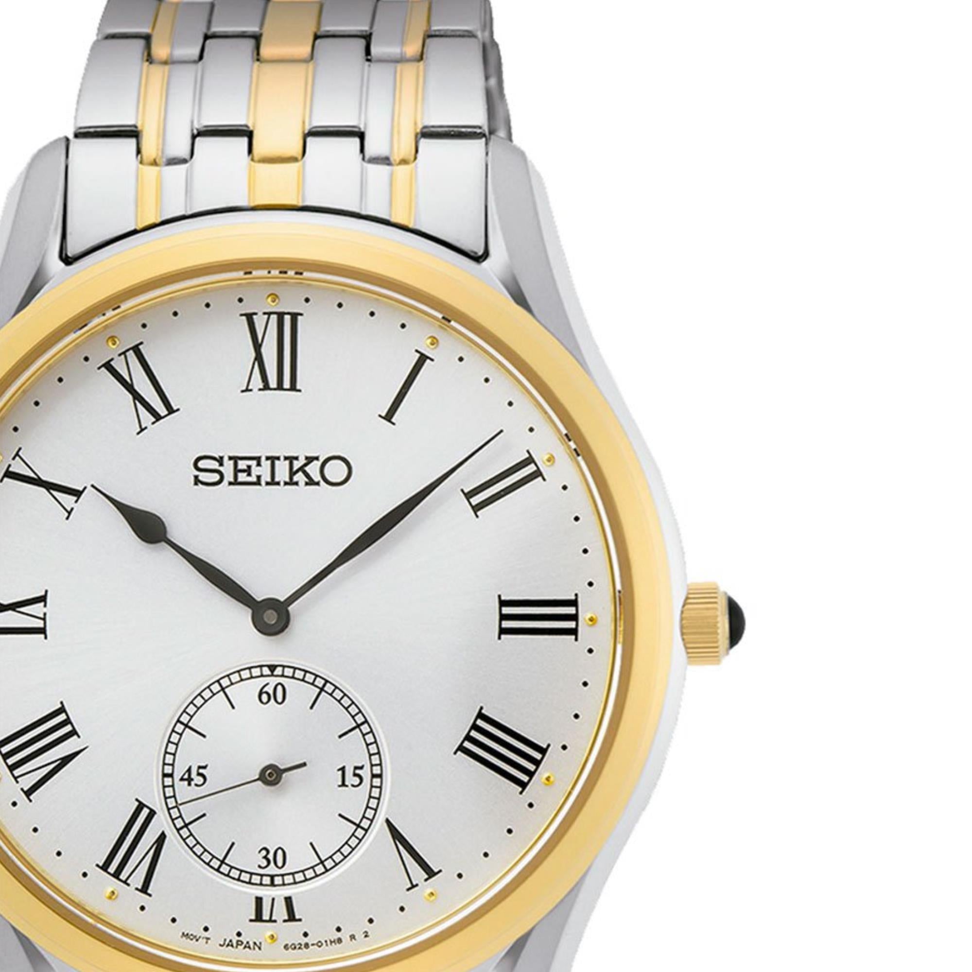 Seiko Essentials watch SKU SRK048P1 focusing on the white dial with black Roman numerals, small seconds sub-dial and gold-tone bezel