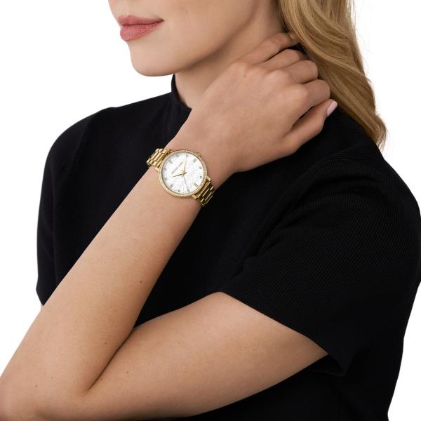 Michael Kors Pyper MK4666 gold-tone stainless steel ladies watch on a woman's wrist