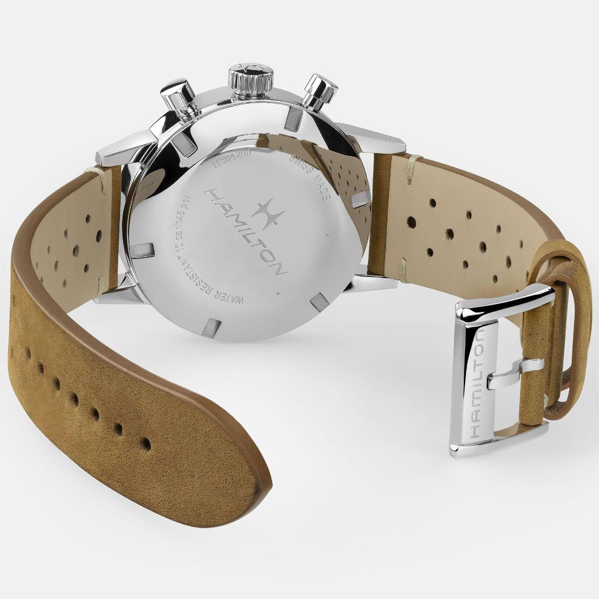 Caseback of a stainless steel Hamilton chronograph watch with a tan leather strap