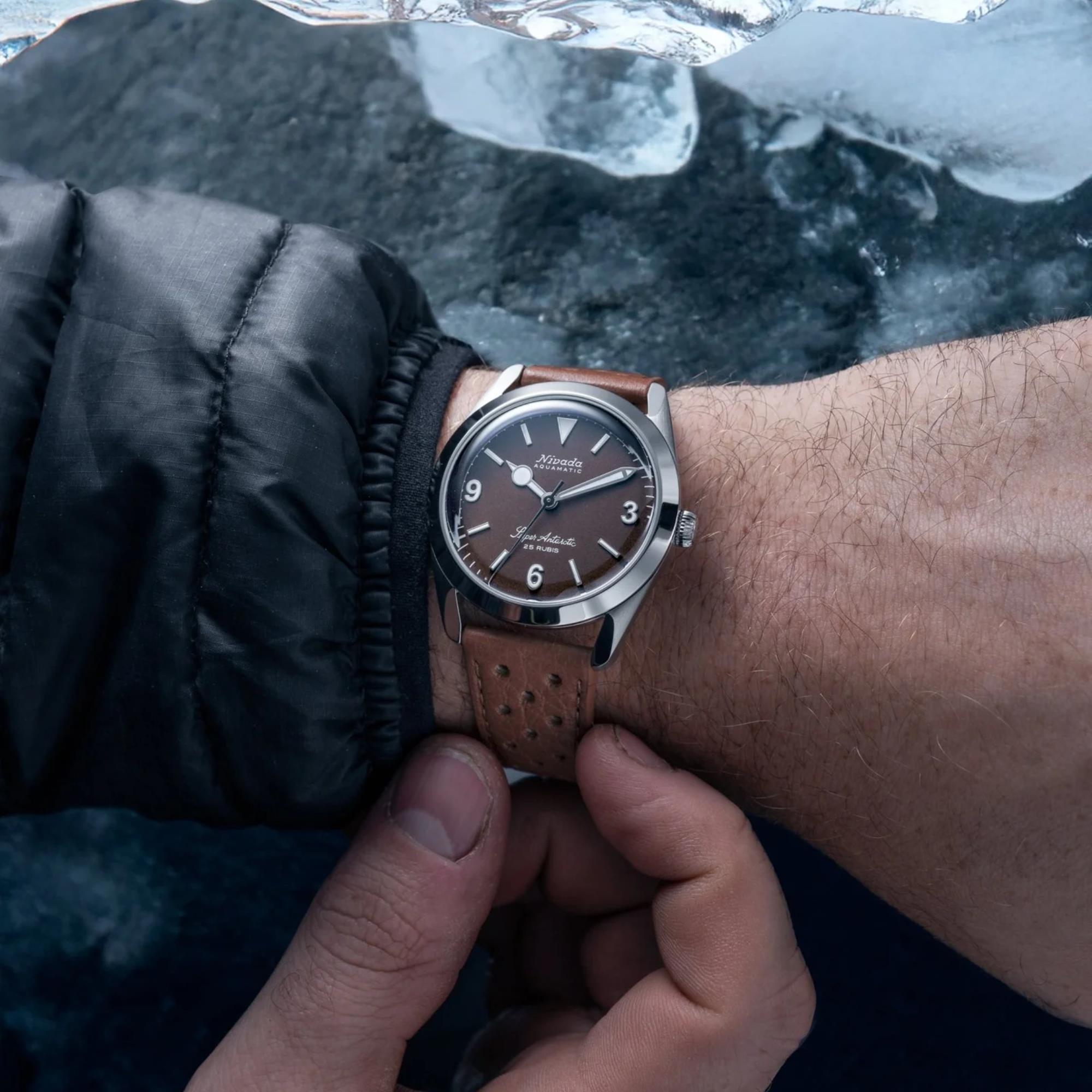 Nivada Grenchen Super Antarctic 32040A23 brown dial mens watch on wrist in icy environment