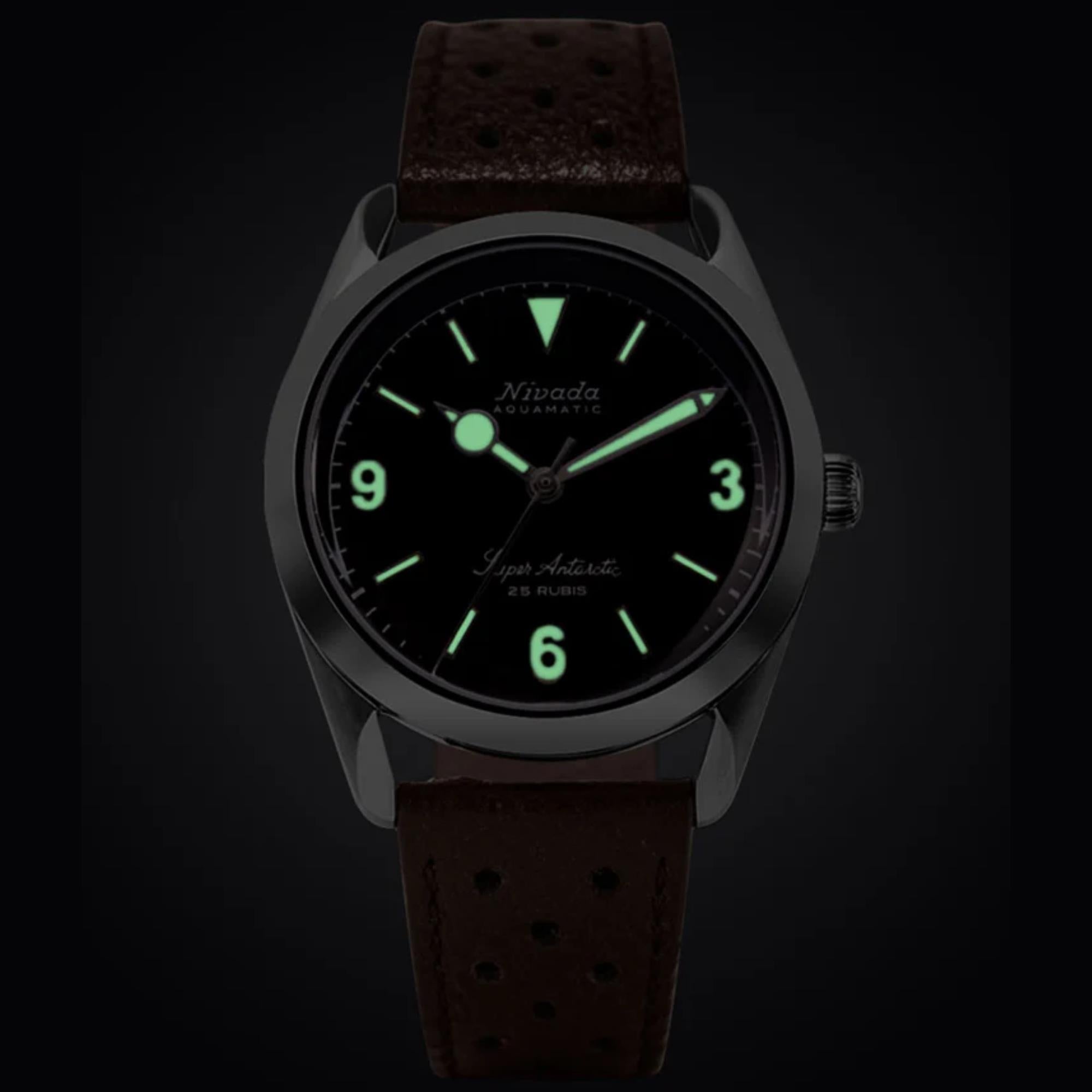Nivada Grenchen Super Antarctic 32040A23 luminous dial hands and indices close up in the dark