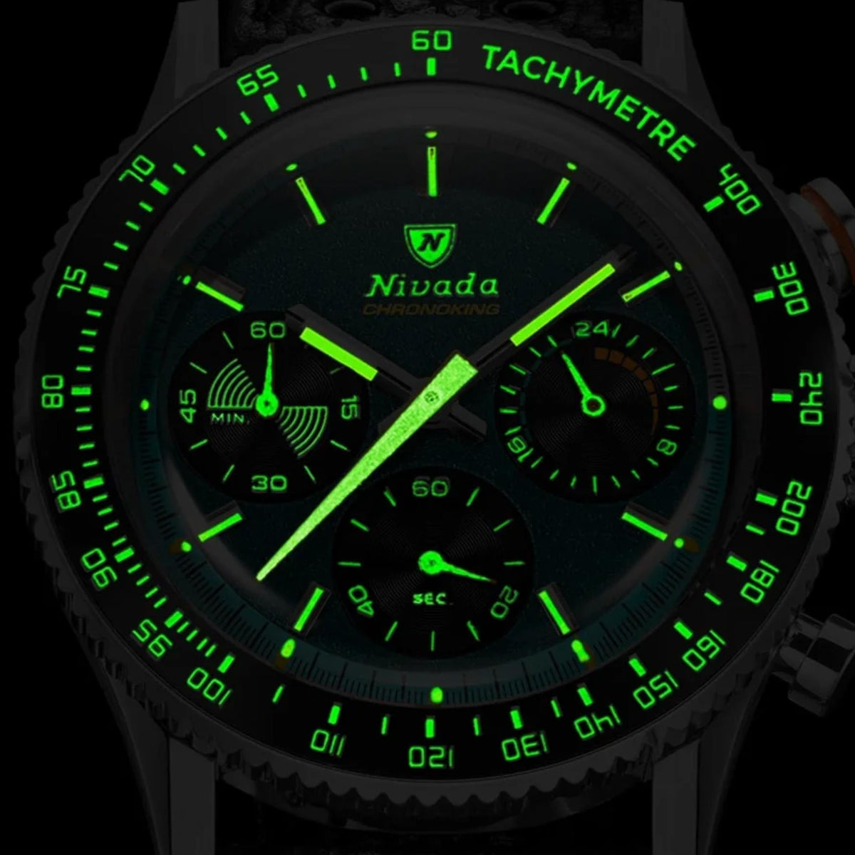 Chronograph quartz watch close-up with luminous green dial, black subdials and markers