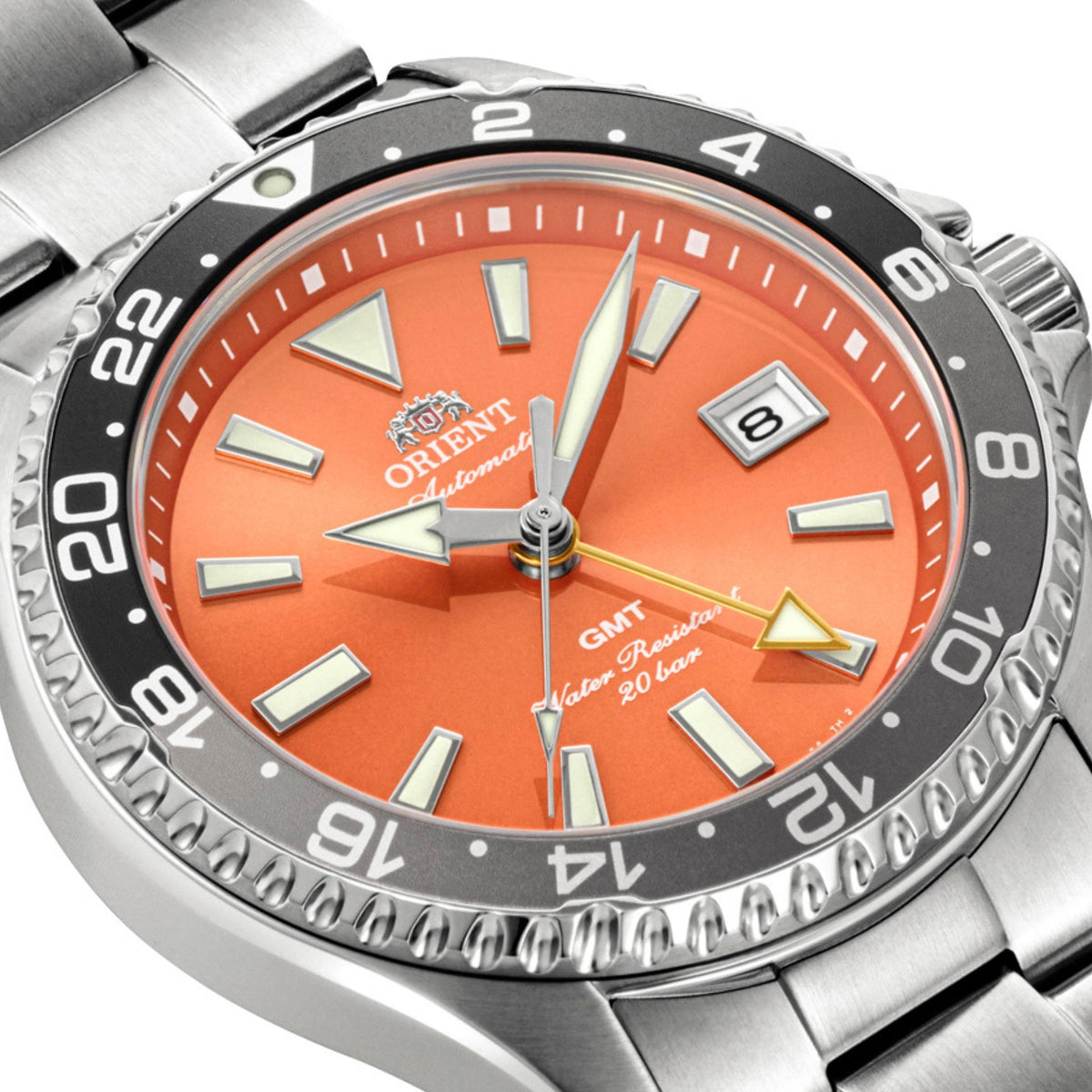 Angled view of Orient Mako GMT orange dial watch RA-BC0004Y30B showing its orange dial, contrasting GMT hand, and a date window