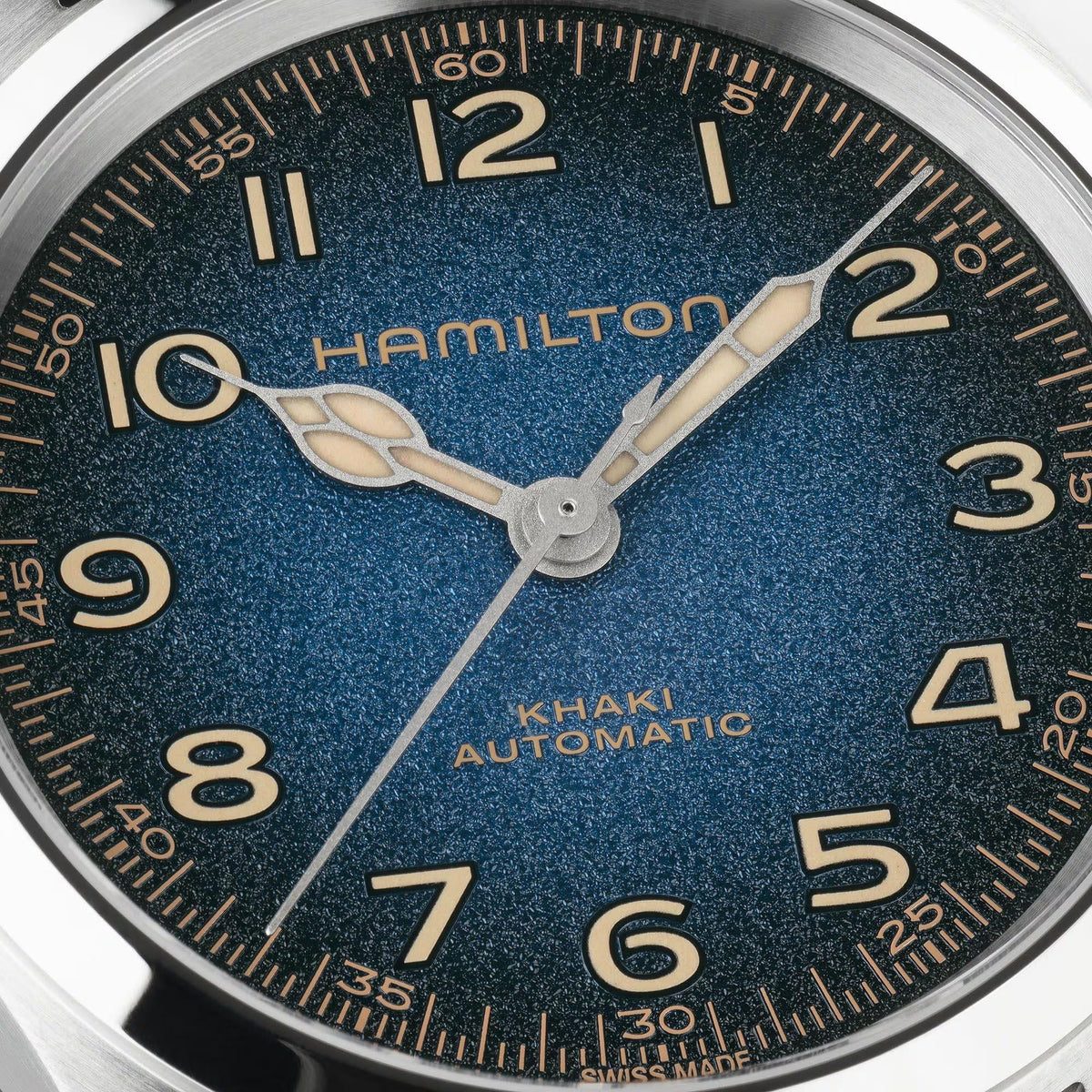 Hamilton Khaki Field Murph H70405140 Swiss automatic watch dial close-up displaying textured blue finish, cathedral hands, and Arabic numerals