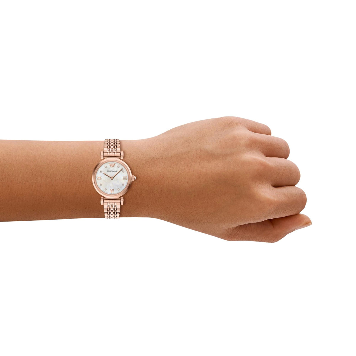 Emporio Armani Gianni AR11805 timepiece on a wrist, showing the 28mm rose gold-tone round case, mother of pearl dial, and slender metallic mesh-style bracelet