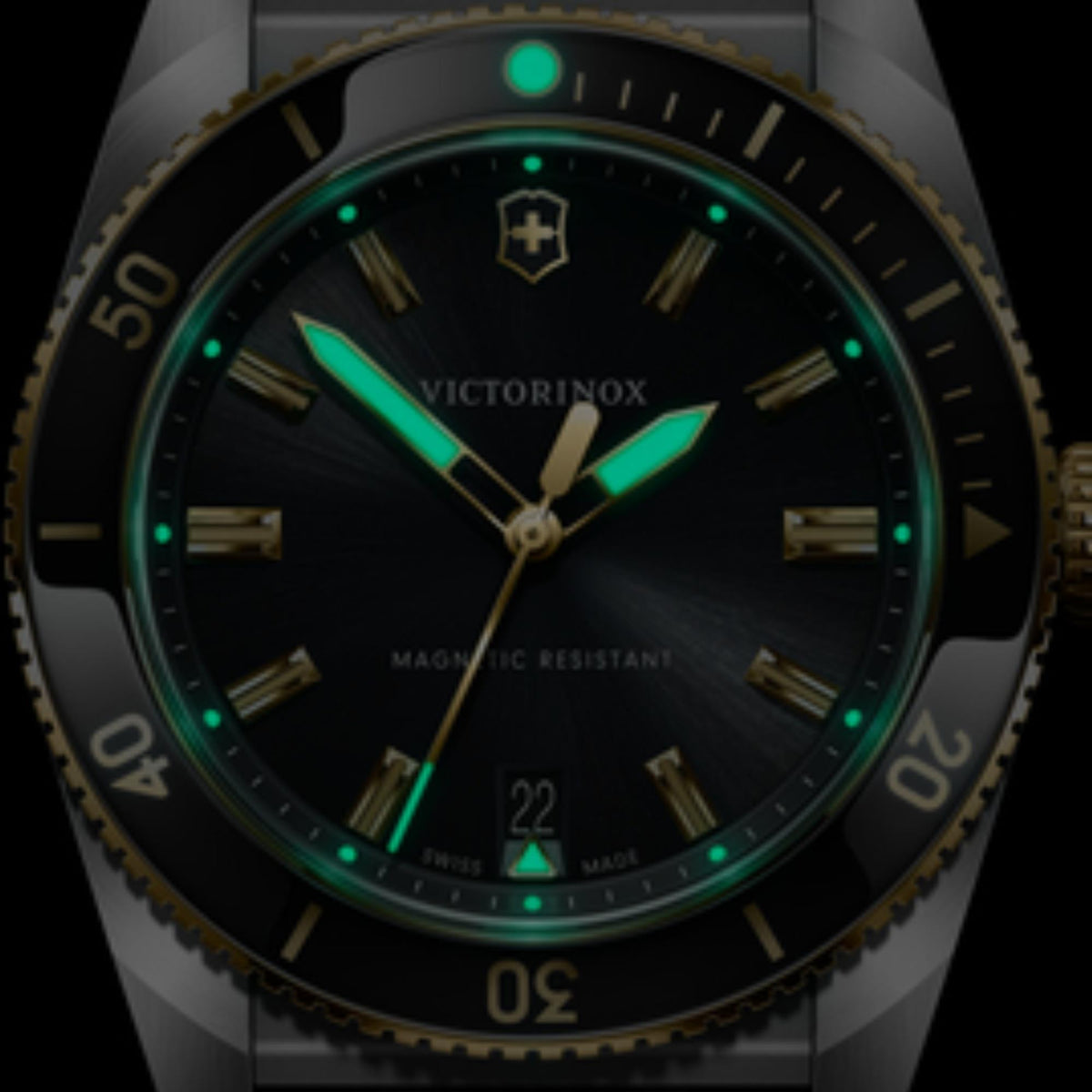 Victorinox Maverick 242099 39mm black dial watch luminescent glow close-up showing green luminous hands and hour markers in dark