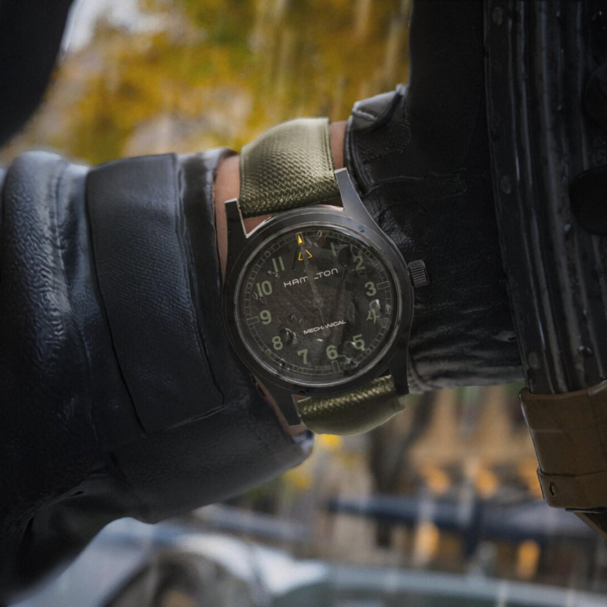 Hamilton Khaki Field Call of Duty H69469930 on-wrist perspective view of black dial manual watch with tactical glove