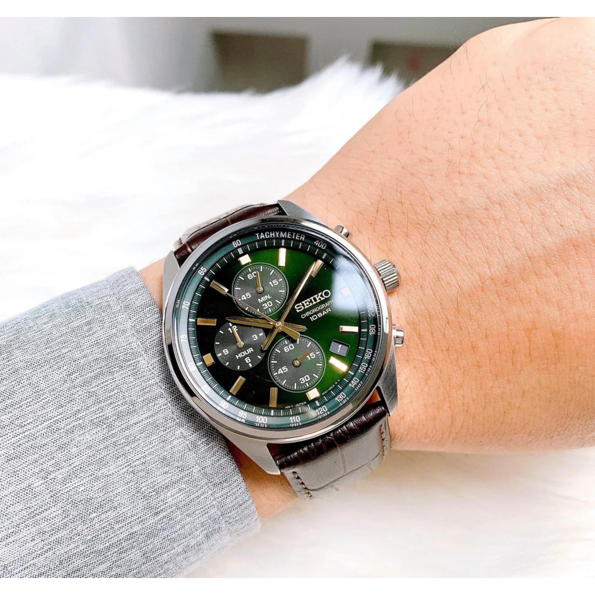 Seiko SSB385P1 green dial chronograph watch worn on wrist with brown leather strap